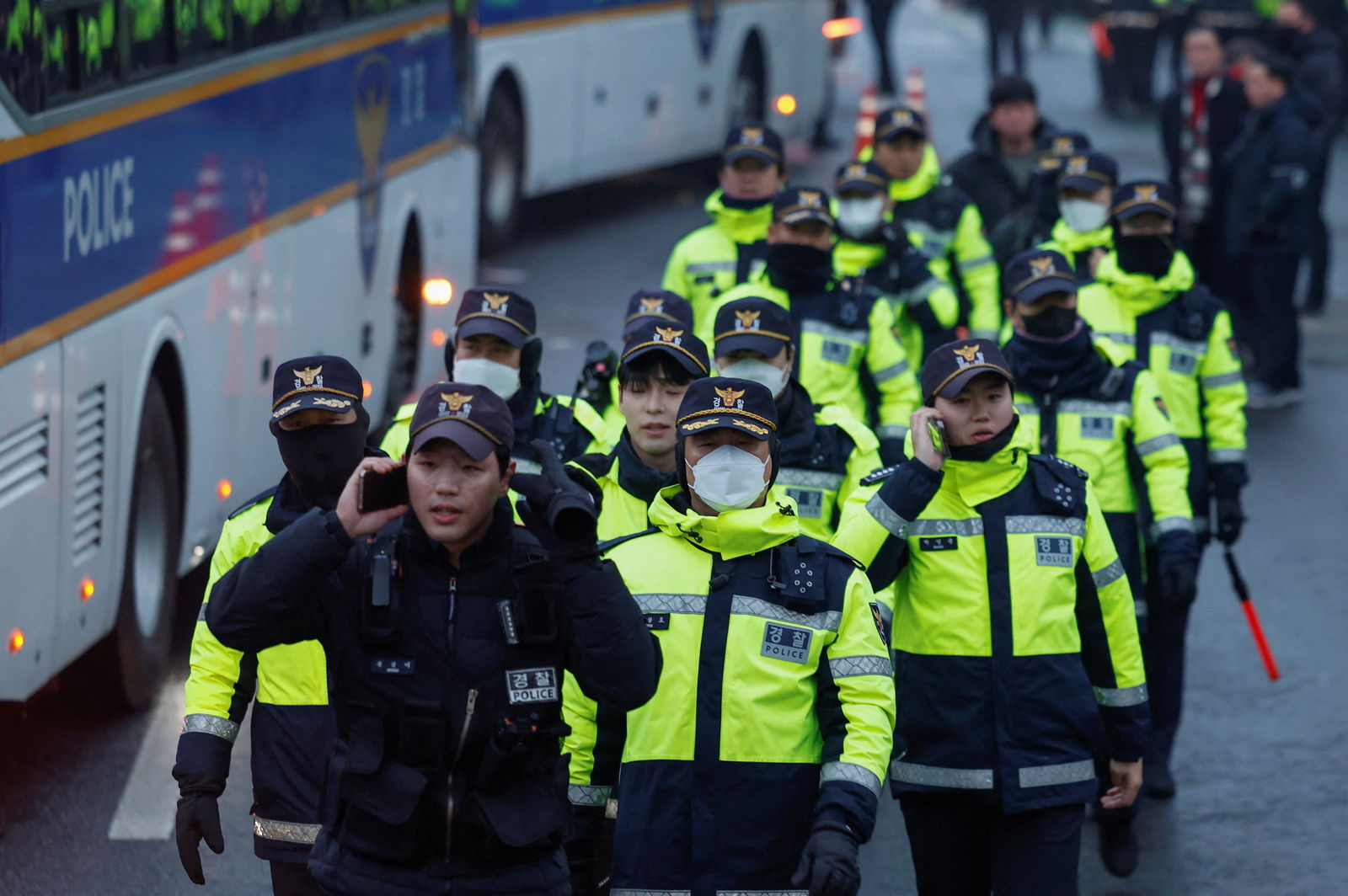 Police officers walk near the official residence of the impeached South Korean President Yoon Suk Yeol in Seoul, South Korea, Jan. 6, 2025.