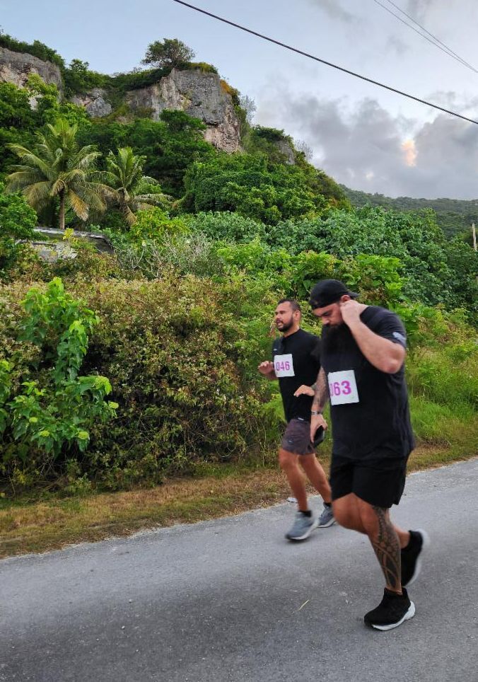 Marvin Tamangided, left, and Sean Torres White of Saipan take on the 5K course of the 2nd Annual Rota Marathon on Jan. 18, 2025.