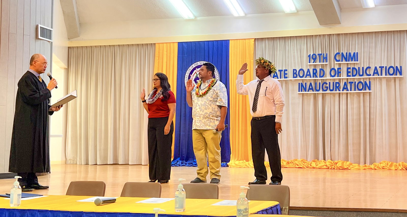 CNMI Supreme Court Associate Justice John Manglona administers the oath of office to Board of Education members Maisie B. Tenorio of Saipan, Aschumar Kodep Ogumuro-Uludong of Saipan, and Anthony DLC Barcinas of Rota.