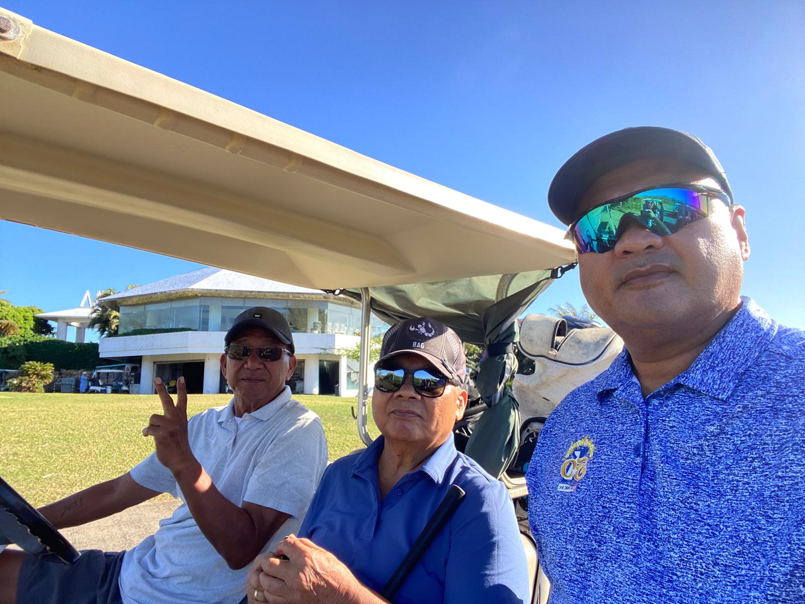 Alfred Aldan, Grina Mizutani and Joe Bermudes pose for a photo before their tee off time.