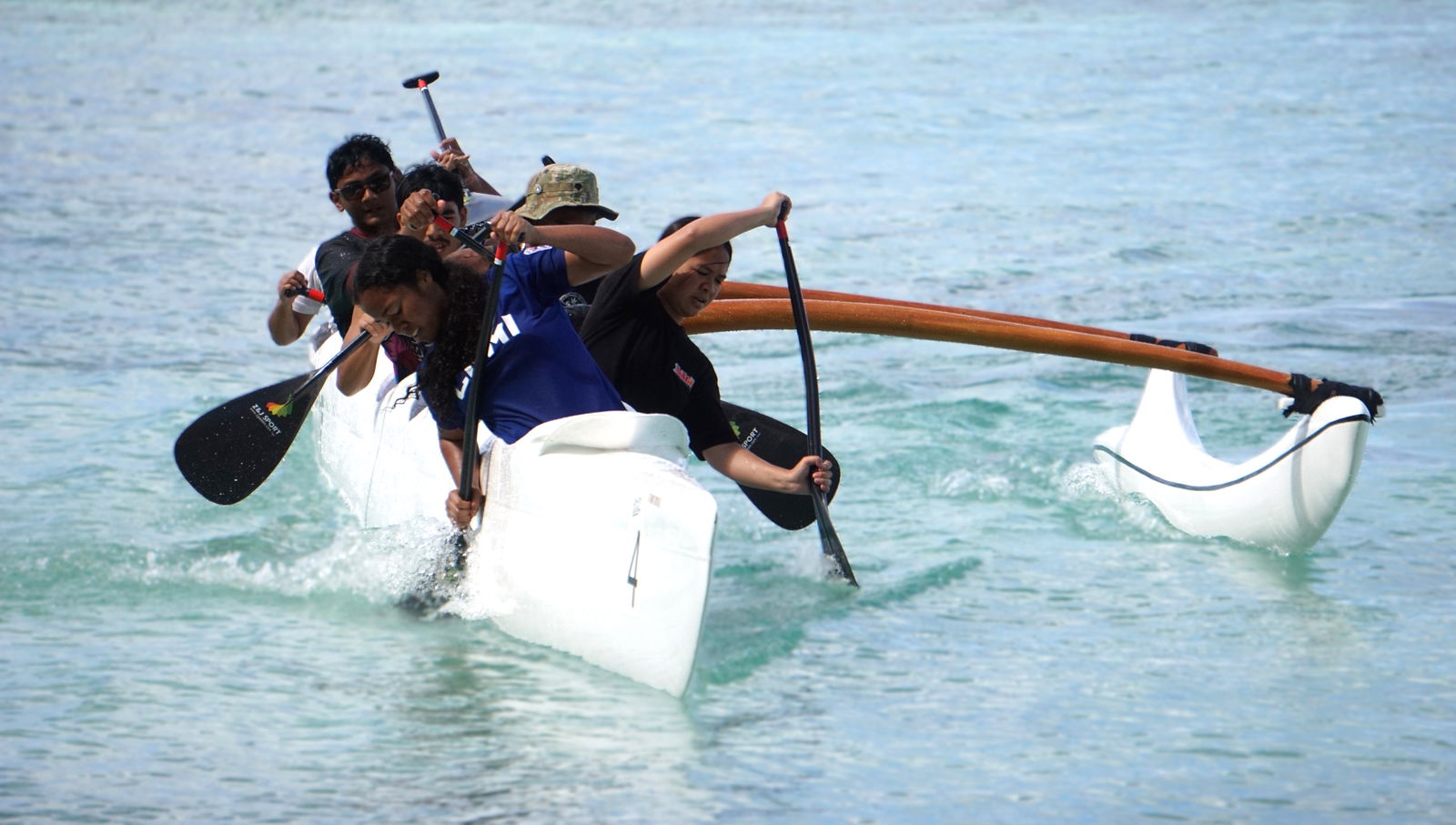 Kagman High School’s mixed division team makes a turn during the 1000m mixed finals in the "no point" opening event of the PSS-NMNPSF Interscholastic Outrigger Race Series SY24-25 on last Saturday at Kilili Beach.
