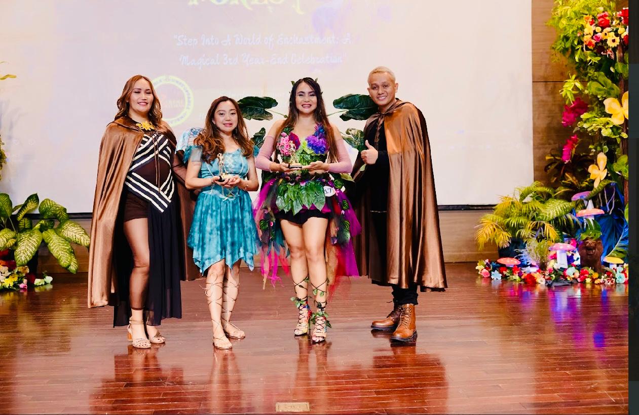 Shadow coaches Crisanta Ocmer-Brien, second left, and Jhoy Revilla receive the Level Up Award from coaches Mitch Olita and Angelo Galfo.