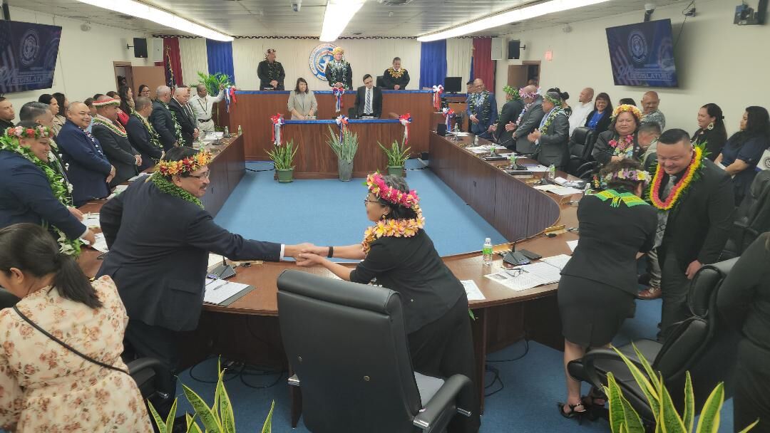 House Floor Leader Marissa Flores and Rep. Patrick San Nicolas shake hands during the 24th House of Representatives inaugural session on Monday in the House chamber on Capital Hill.