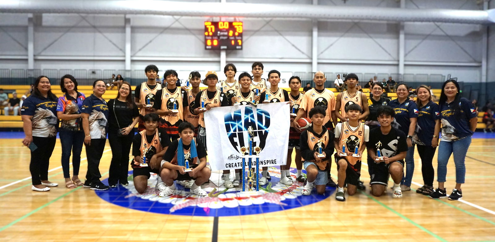 Sophia Althea/Cafe Meraki players pose with the U17 division championship trophy of the 2nd Saipan Magalahi Eagles Club-Saipan MagaHaga Lady Eagles Group Basketball Tournament at the Ada gym on Sunday.