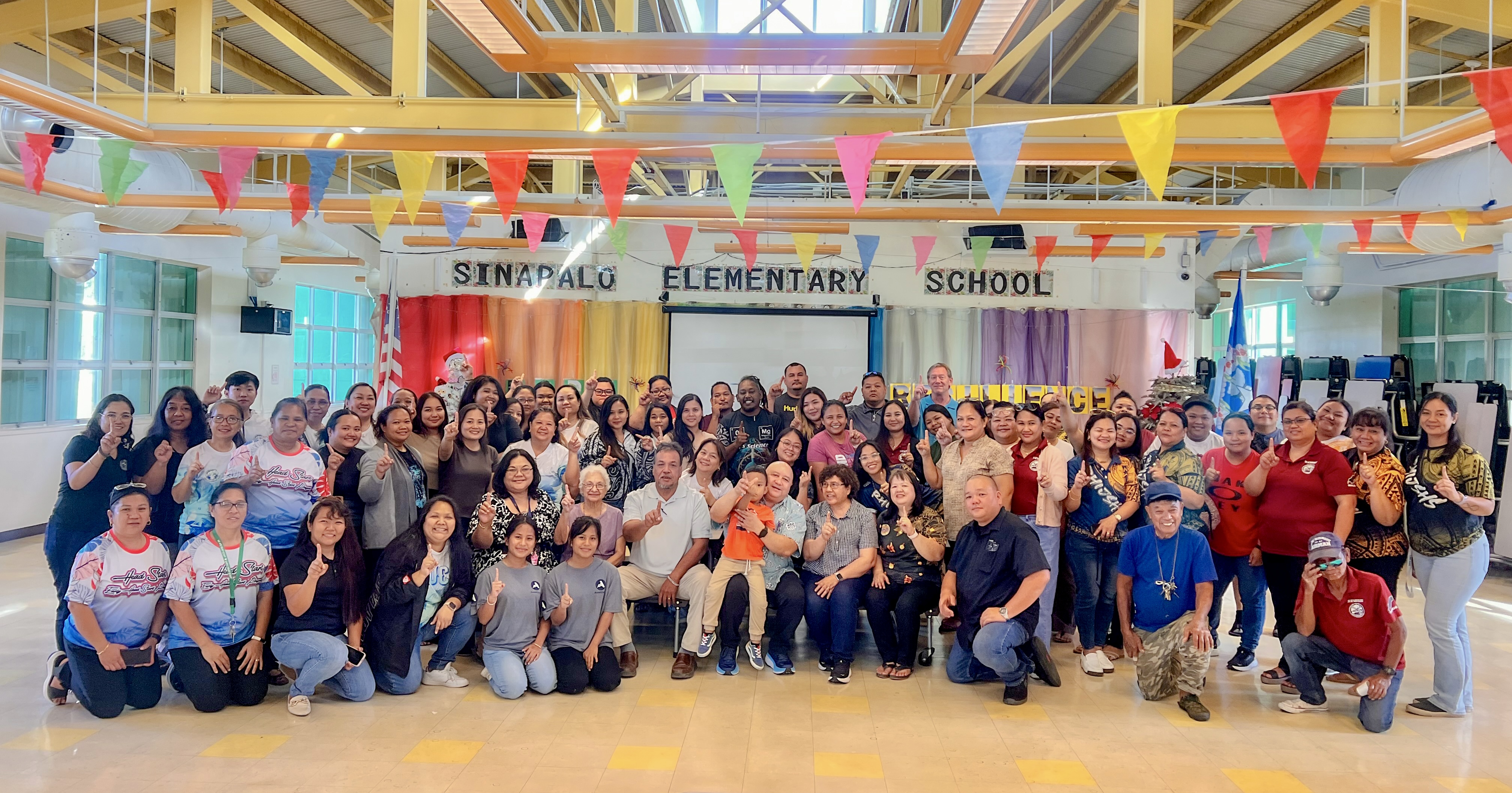 Board of Education Vice Chair Anthony Dela Cruz Barcinas of Rota, seated, 3rd left, poses for a photo with Rota’s public education personnel and Commissioner of Education Dr. Lawrence F. Camacho, third right, seated, at Sinapalo Elementary School on Jan. 24, 2025.