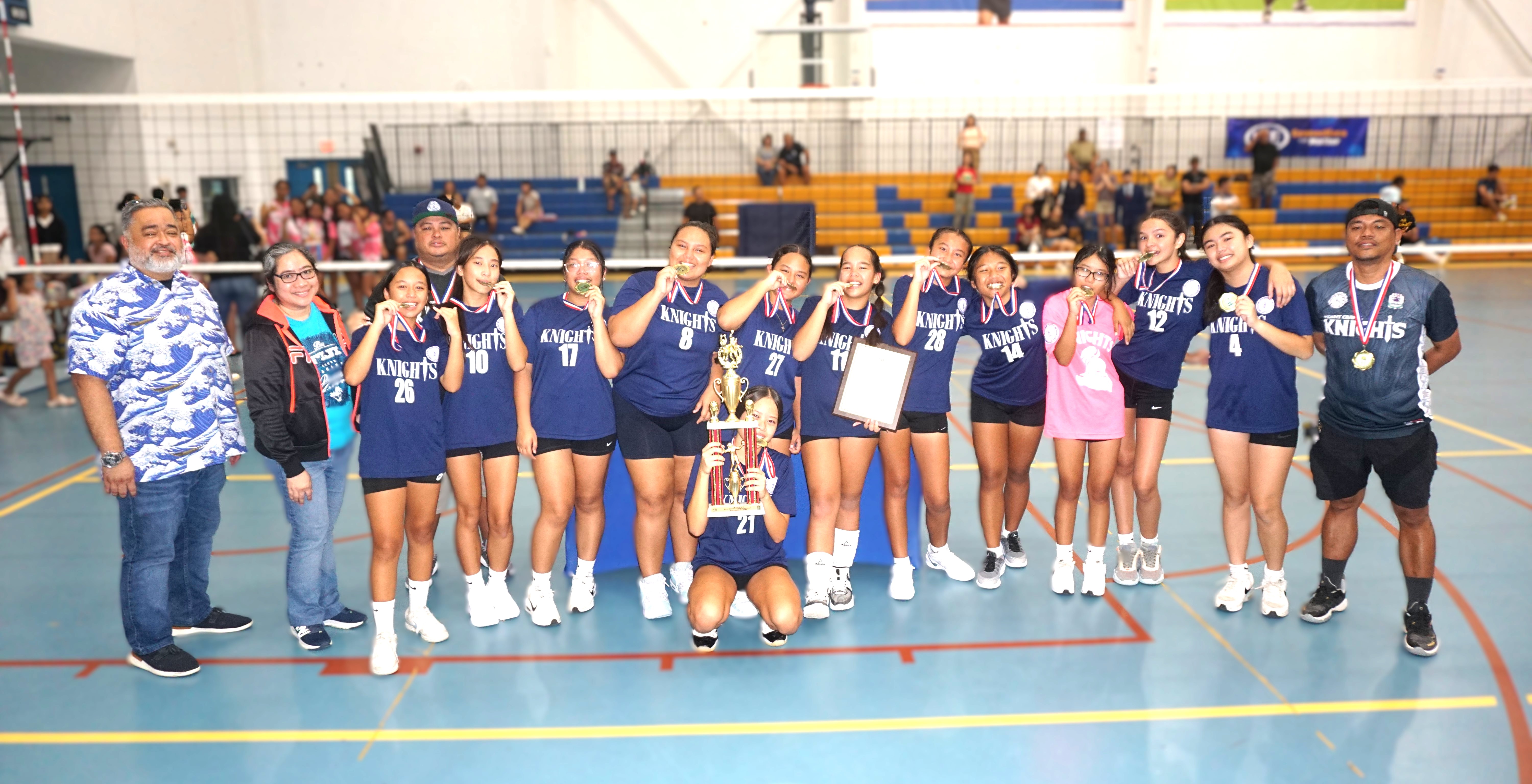 Mount Carmel School players pose with the girls middle school division championship trophy of the PSS-NMIVA Interscholastic Volleyball League SY24-25 at the Marianas High School gym on Saturday.