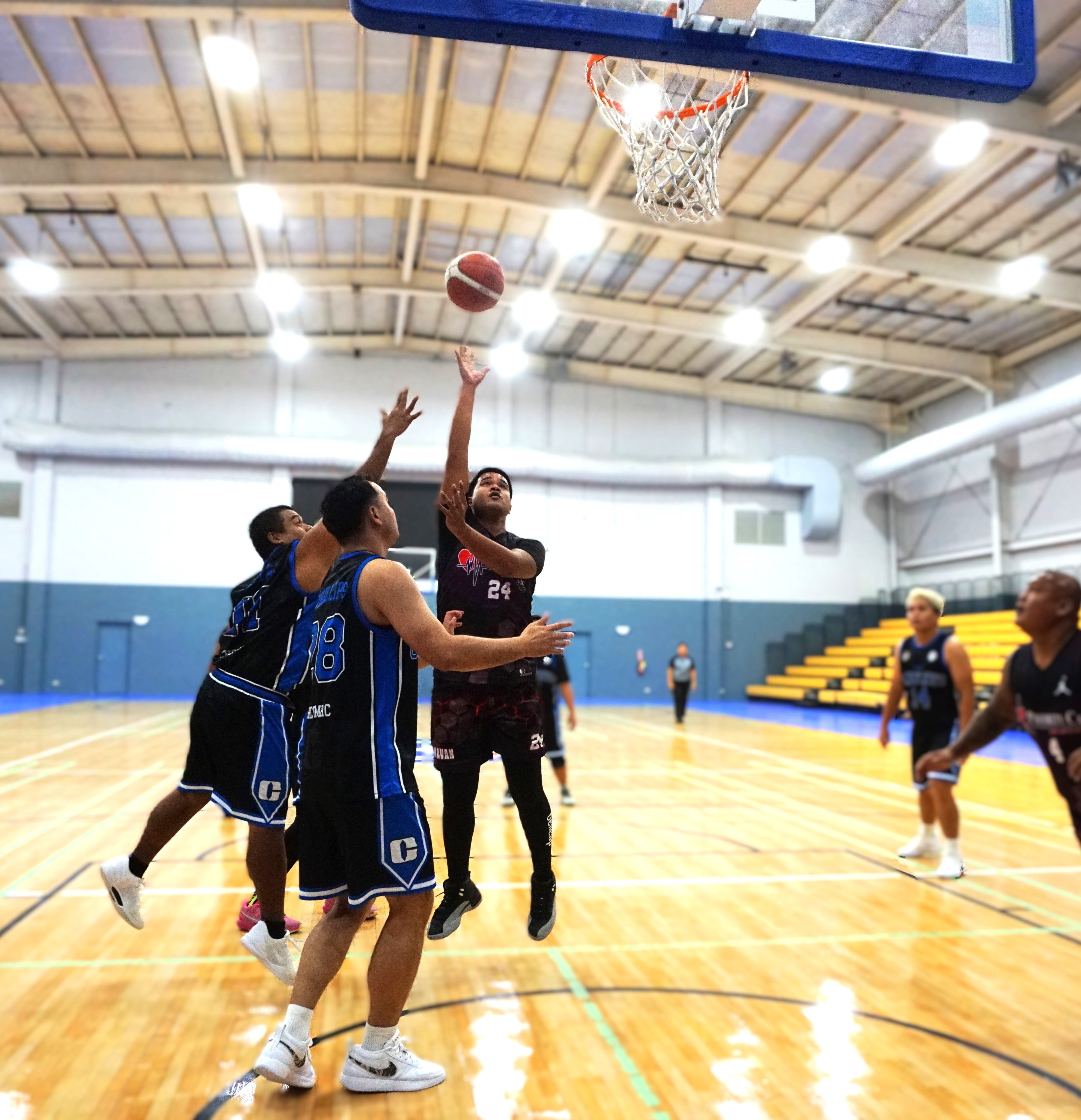 Priority Care's Donavan Pelisamen takes the heavily contested floater during a game against CHCC in the 2024 R&J Wine and Liquor Inter-Government/Business League at the Ada gym on Saturday.