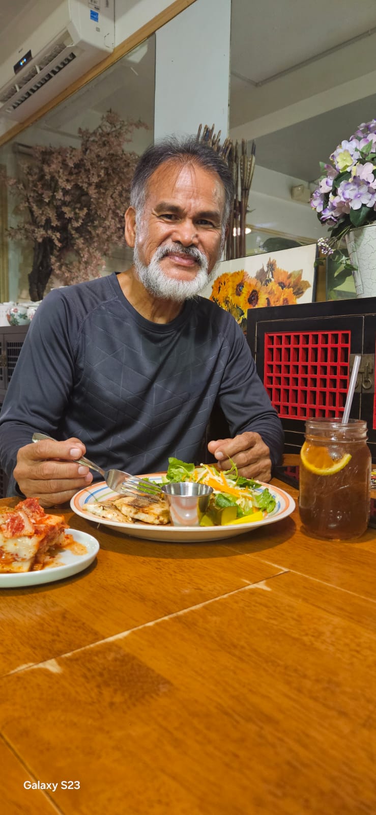 Fabian Indalecio eats a salad.                                                                                                                                                                                                         