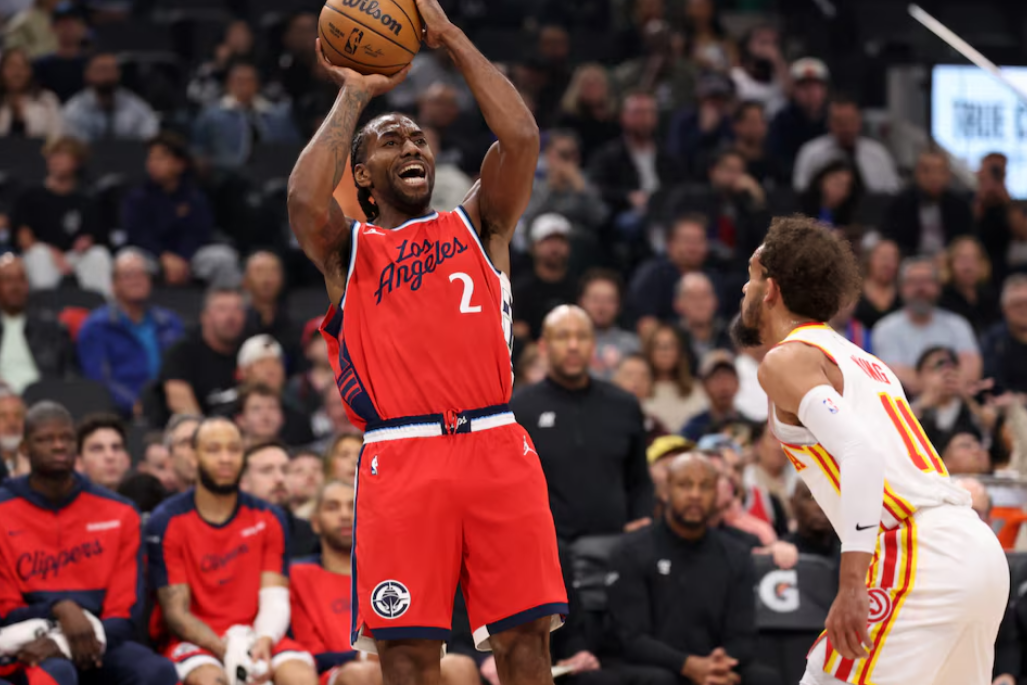 Los Angeles Clippers forward Kawhi Leonard (2) shoots the ball over Atlanta Hawks guard Trae Young (11) during the first quarter at Intuit Dome in Inglewood, California, Jan. 4, 2025.