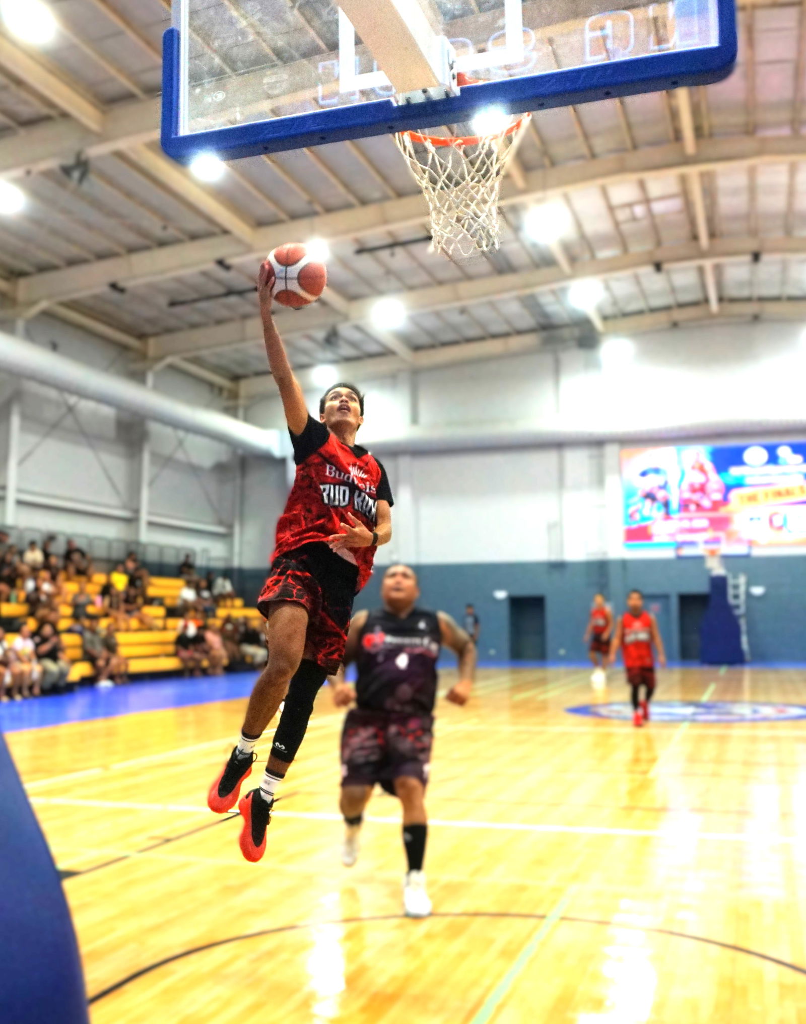 Marpac's Chioni Dela Cruz extends for the fastbreak finish.