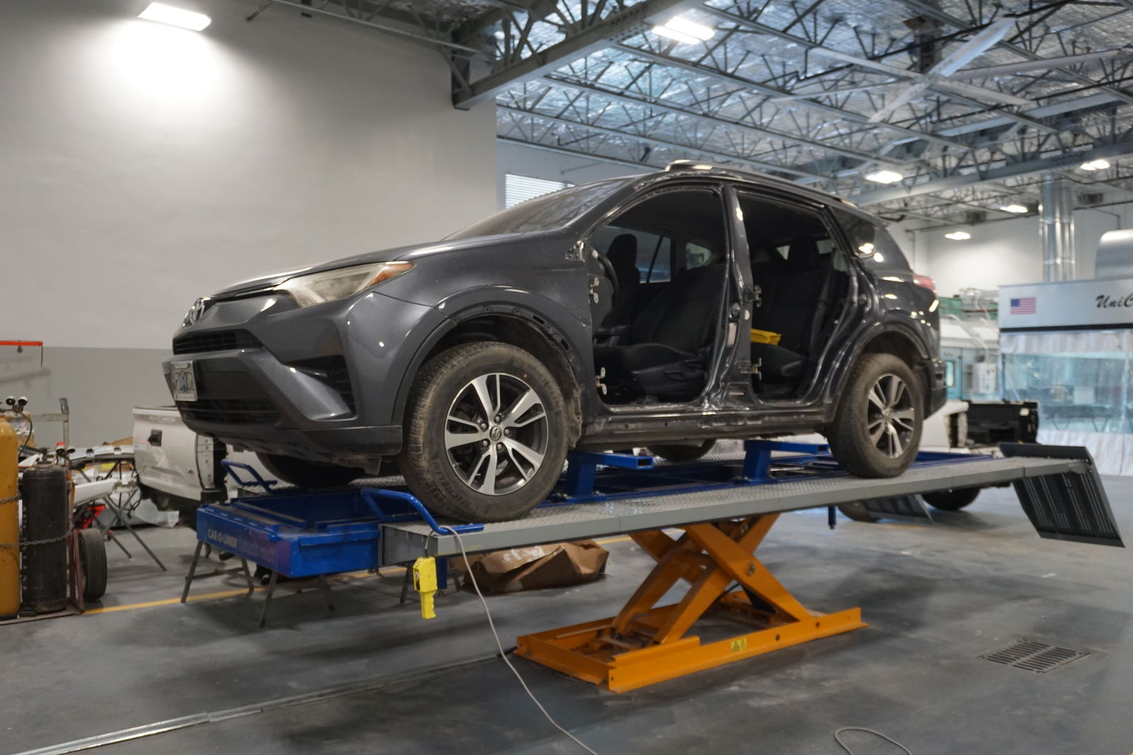 One of the key additions to Toyota's service bay is a frame puller, pictured here, which is a powerful piece of equipment that can take a wrecked vehicle and safely straighten out its chassis. 