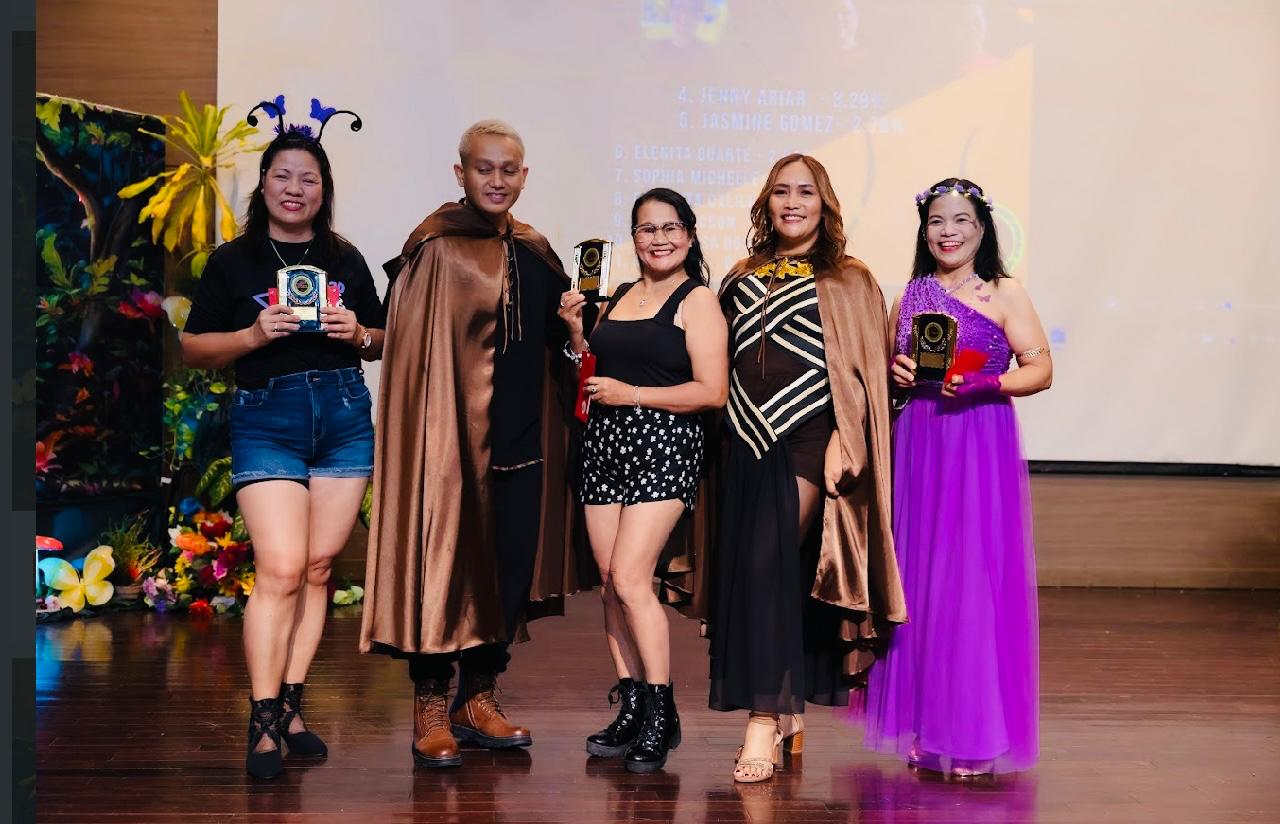 Myrna Manungay, third left, topped the 21-day weight loss challenge. Daisy Javillonar, first left, and Crisanta Villas, fifth left, were second and third. Also in photo are Xtreme Fitness 670 coaches Angelo Galfo, second left, and Mitch Olita, fourth left.