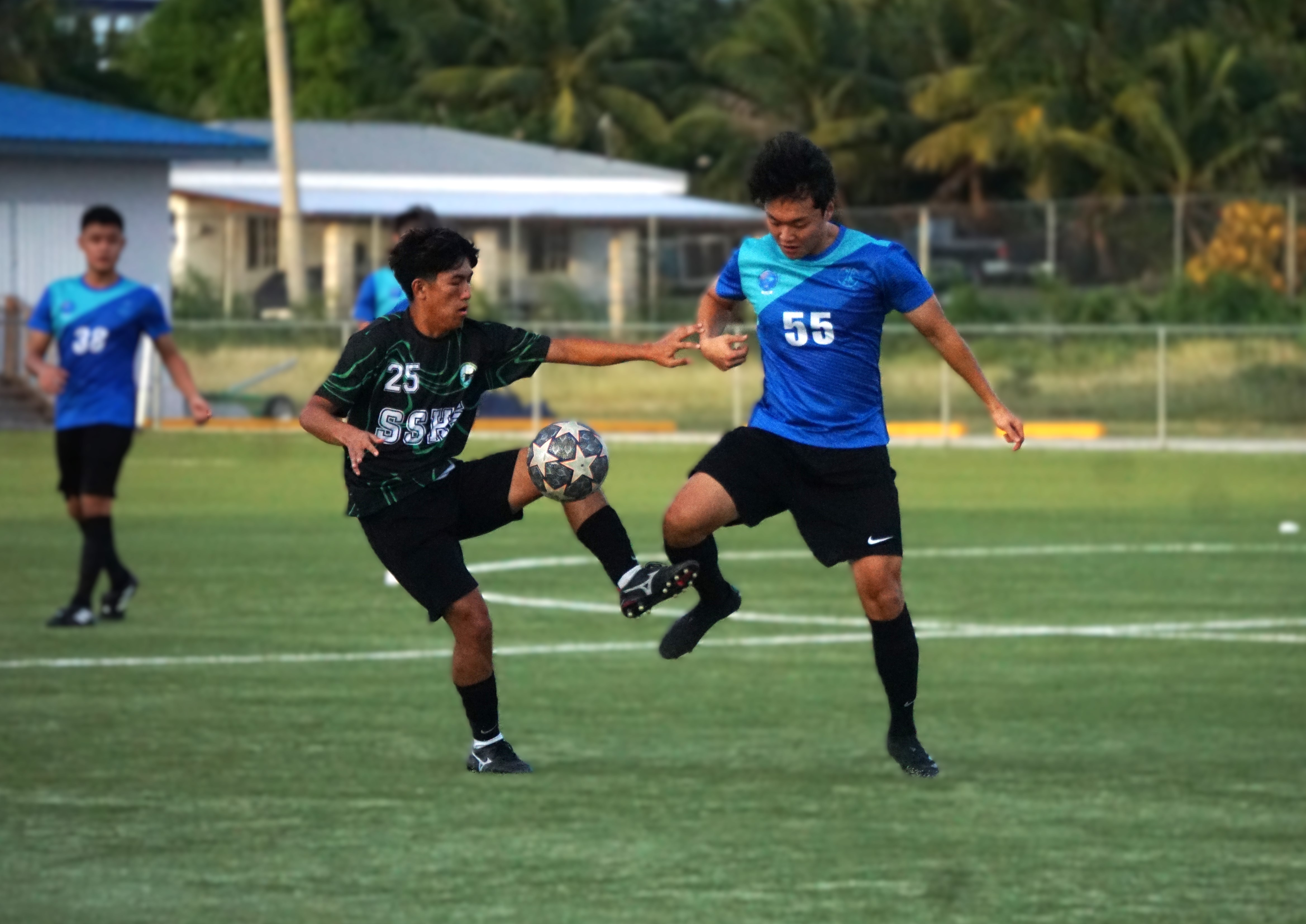 SSHS’ Monico Claridades attempts to control the possession as SIS V's Kwang Hee Lim closes in during a semifinal match in the boys high school division of the PSS-NMIFA Interscholastic Soccer League SY24-25 at the NMI Soccer Training Center in Koblerville on Tuesday.
