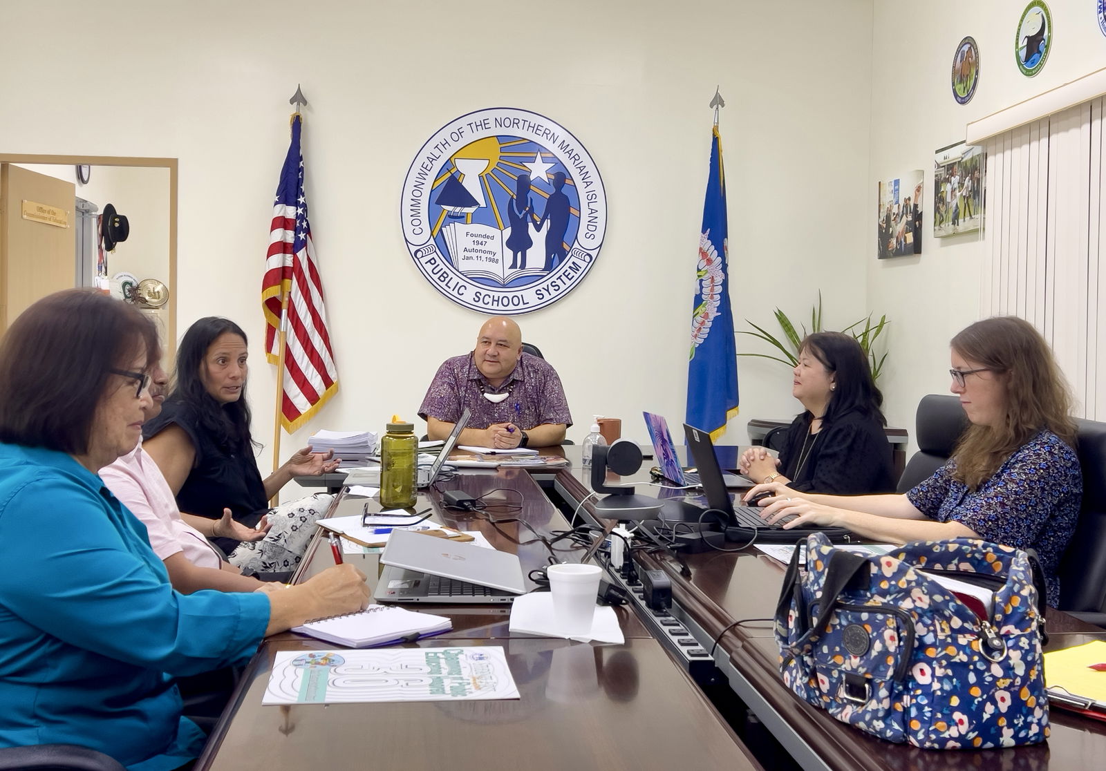 Susan Shebby, third left, shares the goals of the U.S. Department of Education’s Comprehensive Centers Network, as Commissioner of Education Dr. Lawrence F. Camacho, educators Dr. Rita A. Sablan, Sinton Soalablai, Dr. Rizalina Liwag and Erin D’Amelio listen.