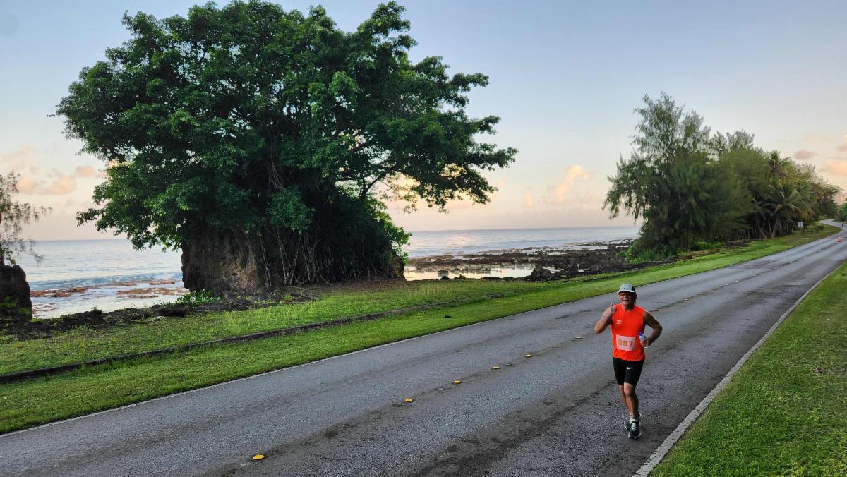 Daniel Calvo of the Marianas takes in the sights as he heads to the finish line of the half marathon course during the 2nd Annual Rota Marathon on Jan. 18, 2025.
