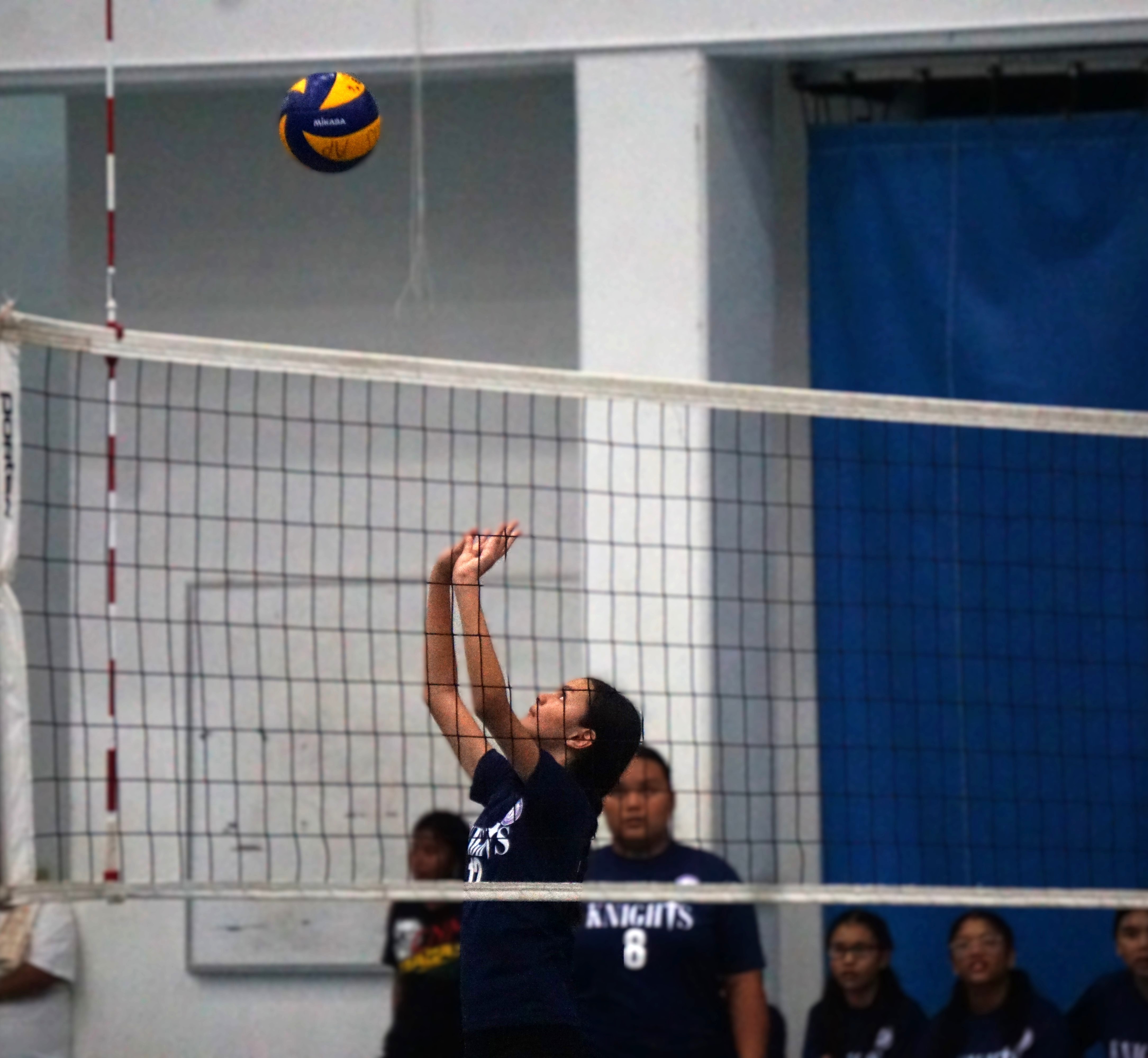 A Mount Carmel School varsity player sets up for a return play during a game in the girls middle school division of the PSS-NMIVA Interscholastic Volleyball League SY24-25 at the Marianas High School gym.