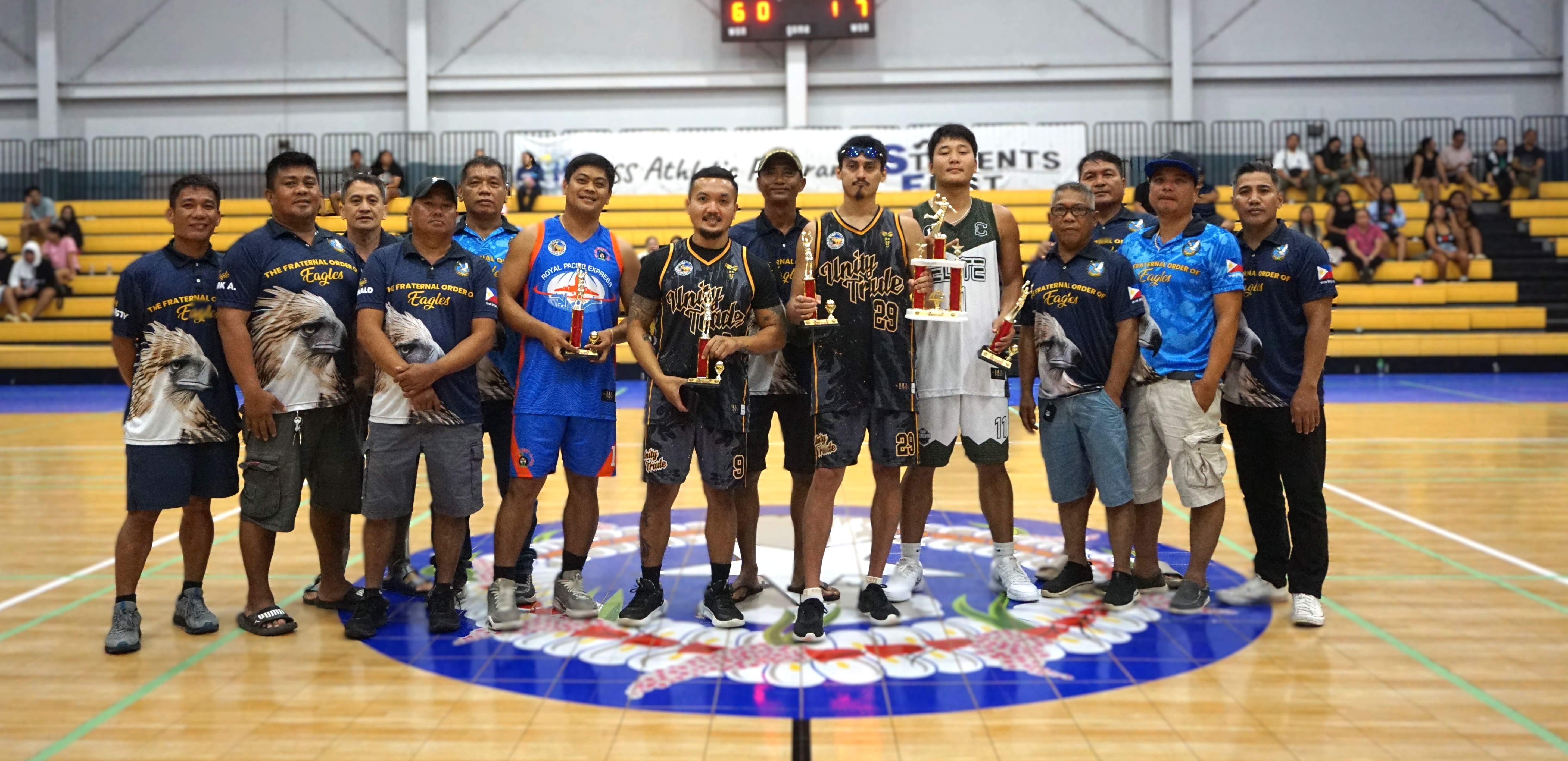 The Mythical Five in the open division of the 2nd SMEC-SMLEG Basketball Tournament pose for a group photo with SMEC officials during the awards ceremony at the Ada gym on Sunday.