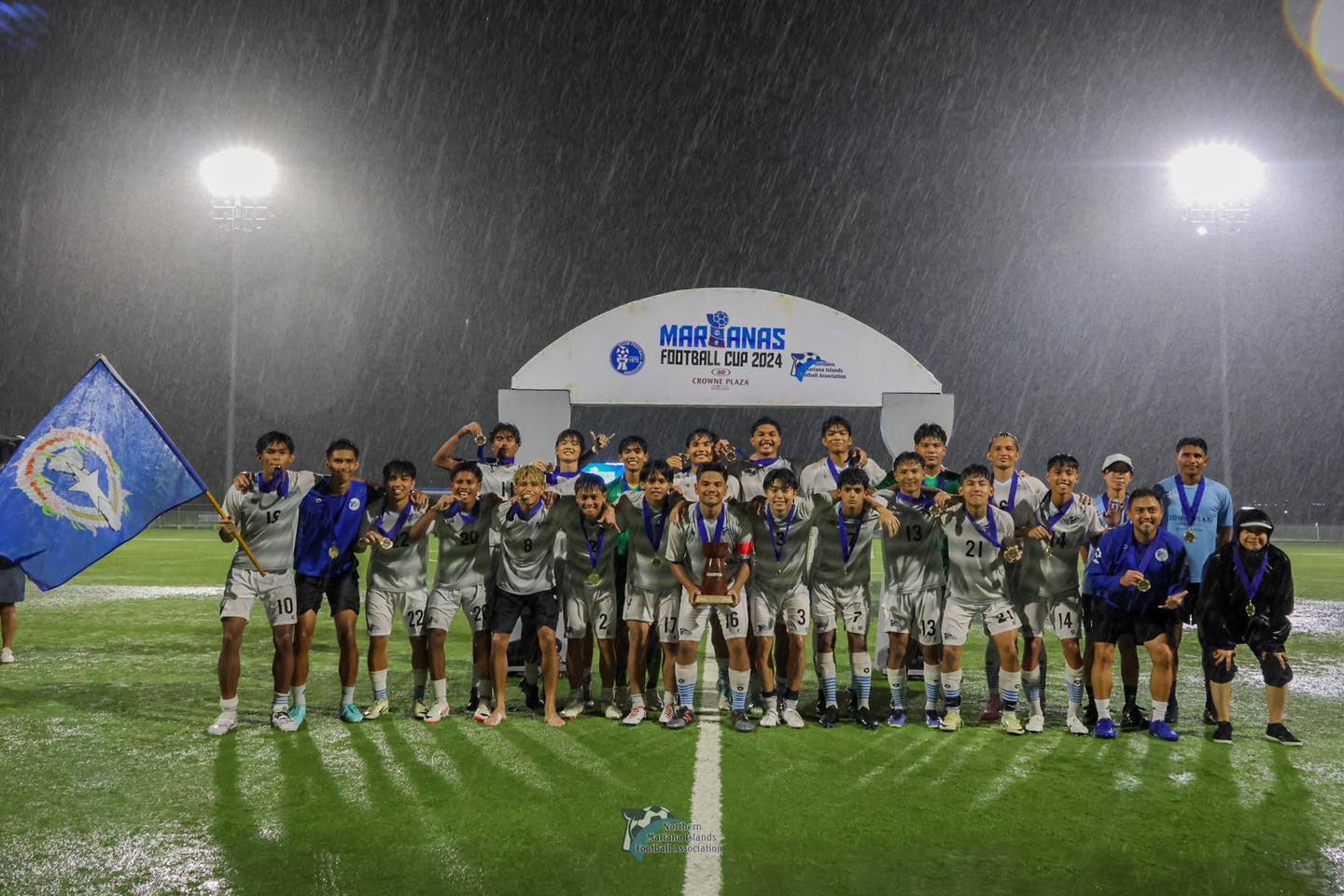 Team NMI players pose for a photo after their victory in the 2024 U20 Men’s Marianas Football Cup at the NMI Soccer Training Center in Koblerville.