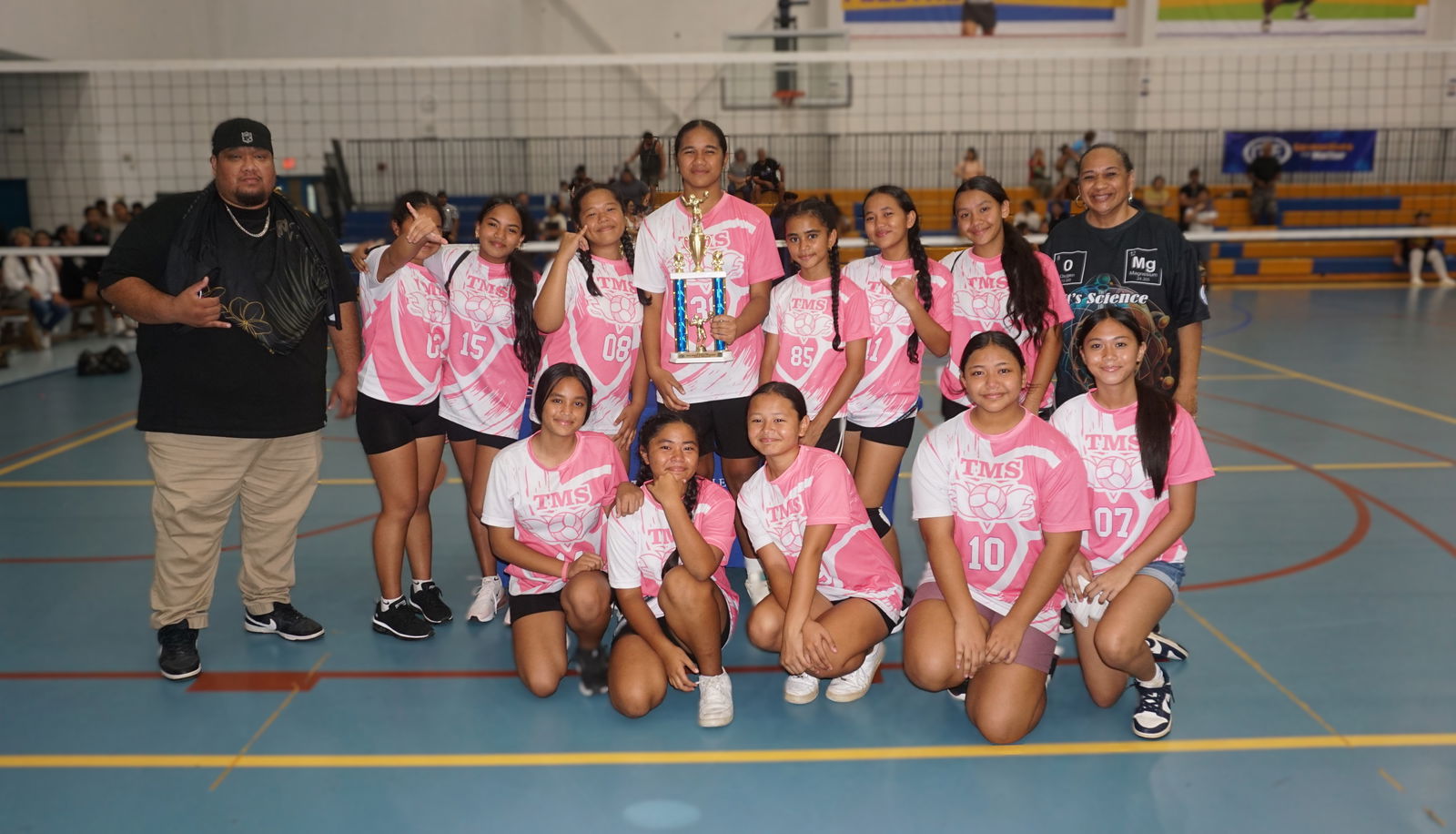 Tanapag Middle School players pose with the second-place trophy. 
