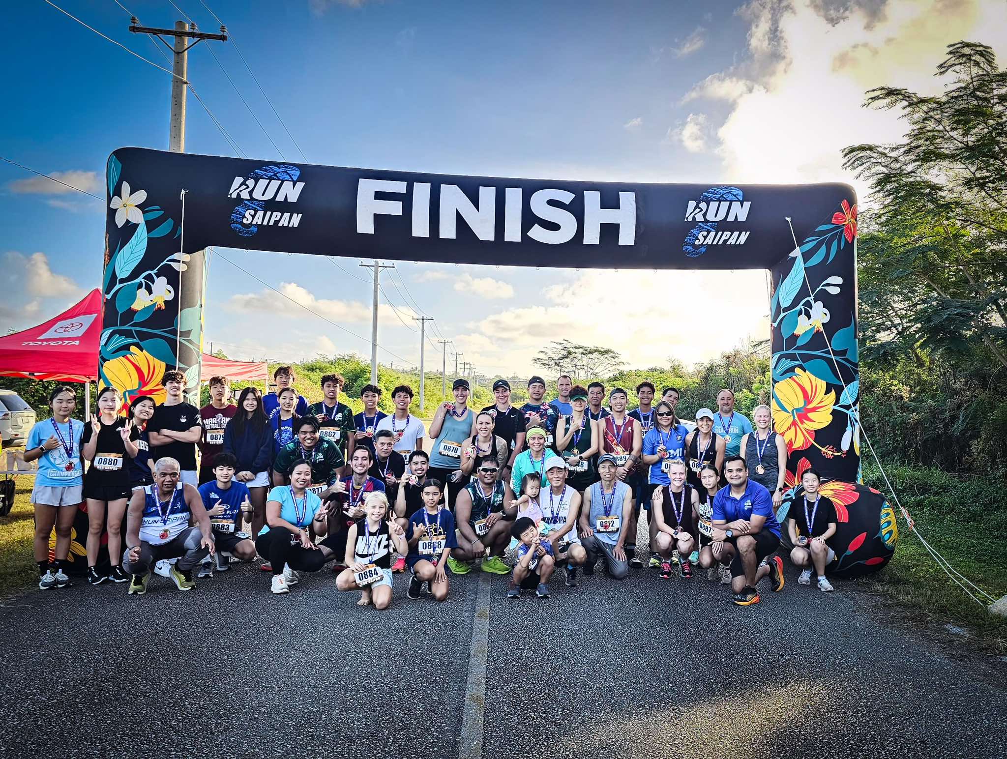 Participants of Run Saipan’s 4th Annual Saipan International Airport Trail Run pose for a group photo.