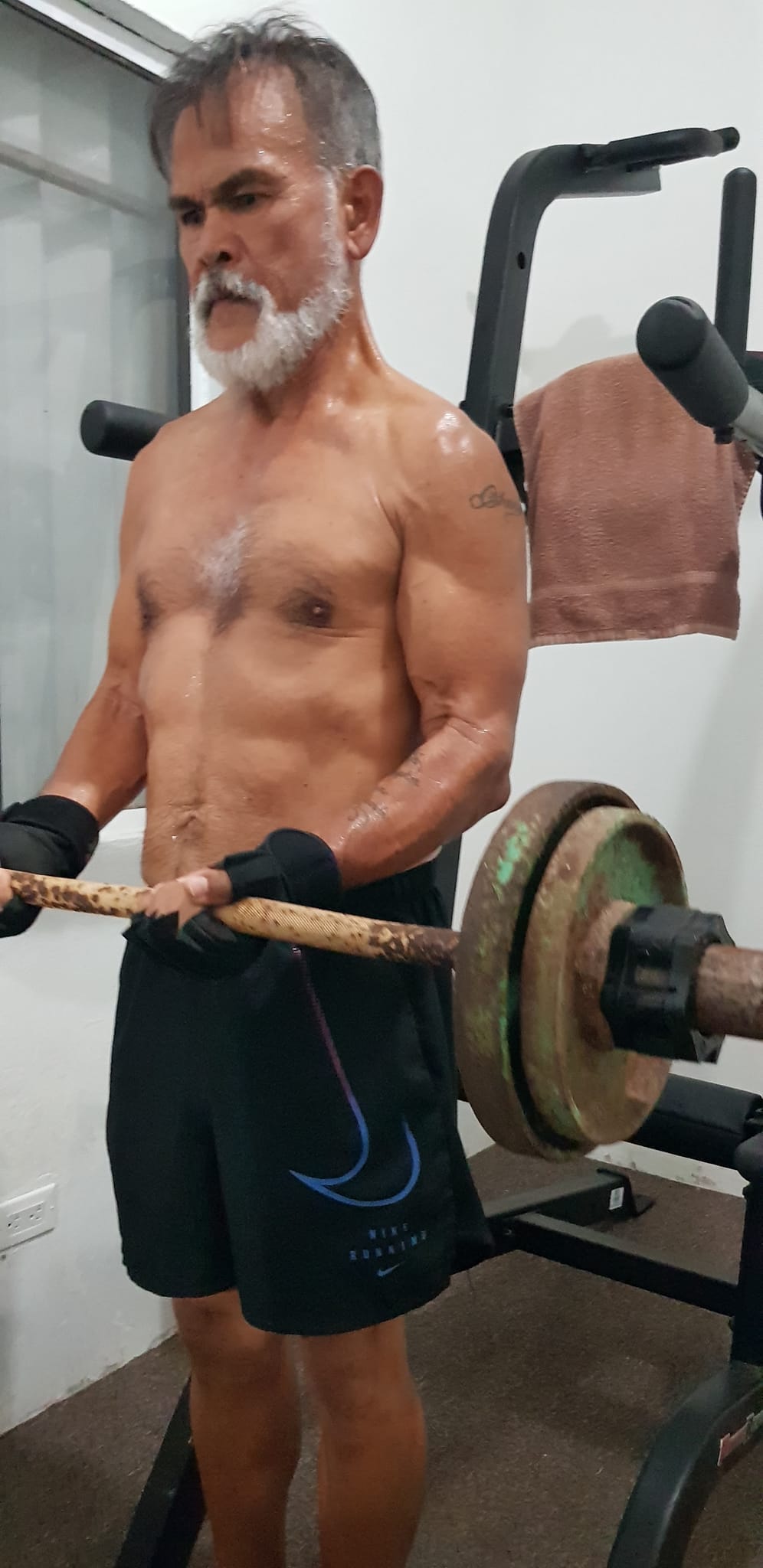 Fabian Indalecio works out at his mini-gym at home. 