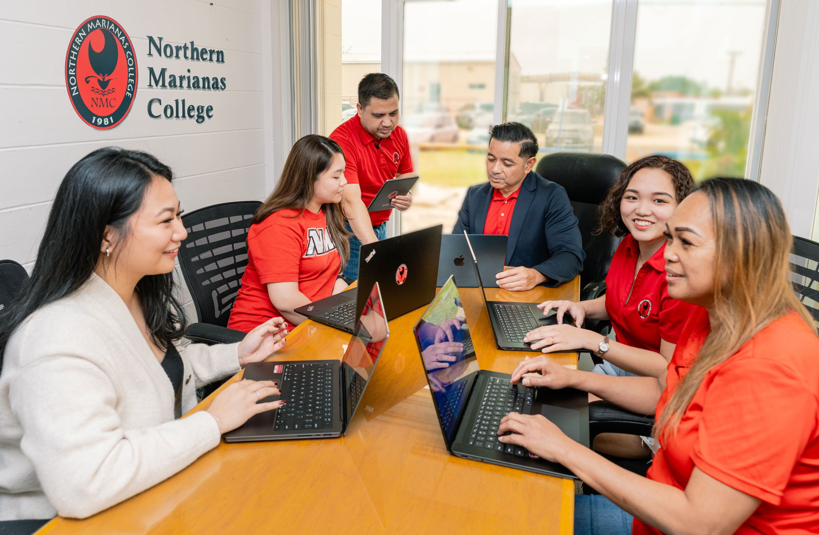 Northern Marianas College Vice President for Administration and Advancement Frankie Eliptico, center, works with various staff members of NMC’s Information Technology, Finance, Admissions and Records, and Financial Aid departments during a live simulation training of Ellucian Colleague, a new cloud enterprise resource planning software. 