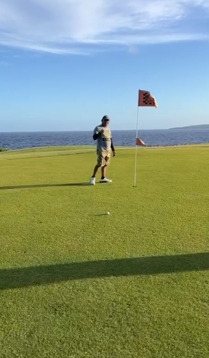 Rafael Demapan holds his lucky golf ball.