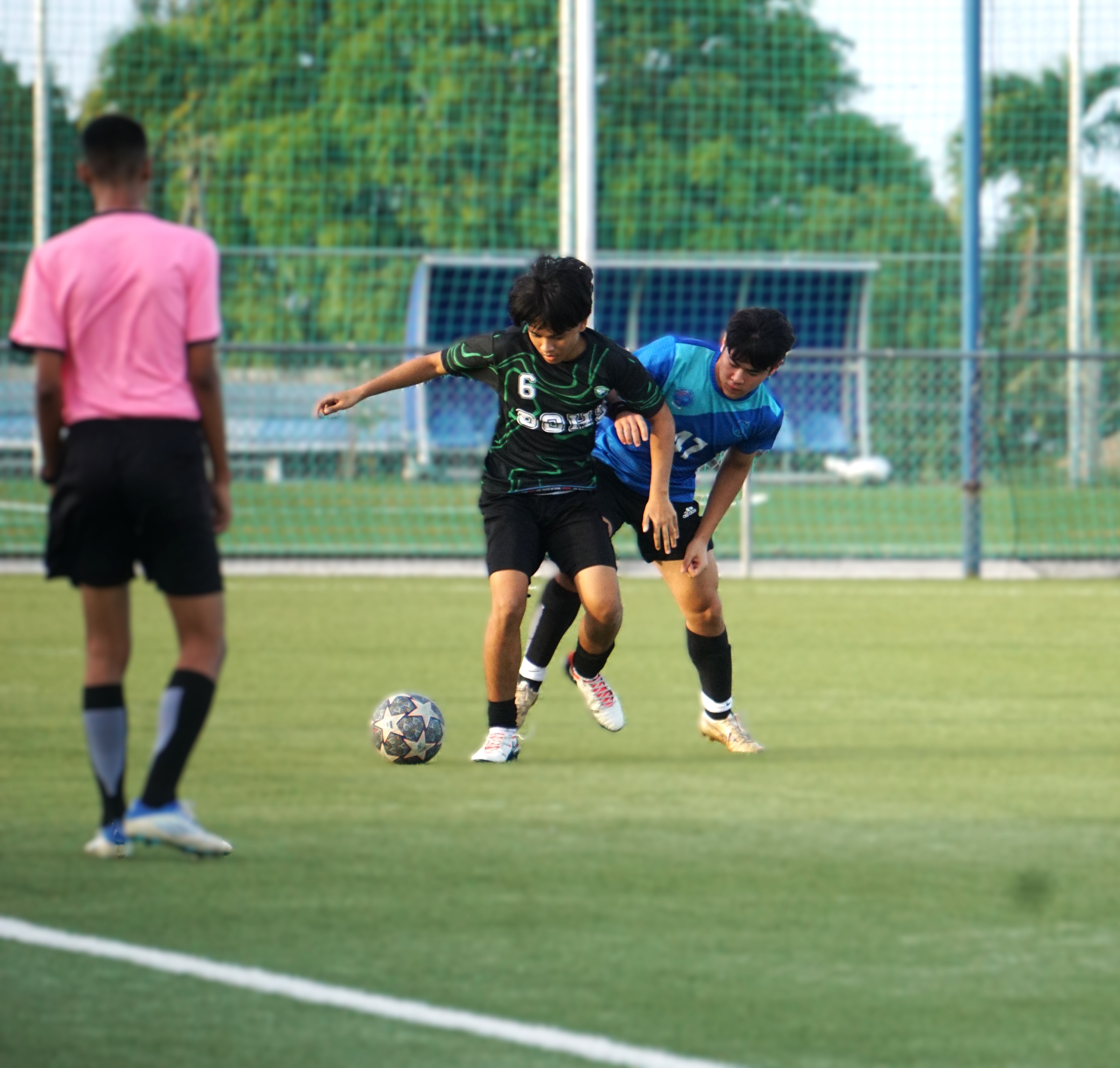 SSHS' Anthony Austria and SIS V's Jun Kim battle for the possession during a semifinal match in the boys high school division of the PSS-NMIFA Interscholastic Soccer League SY24-25 at the NMI Soccer Training Center in Koblerville on Tuesday.