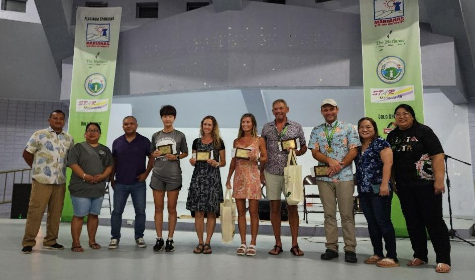 Top marathoners in the 2nd Annual Rota Marathon on Jan. 18, 2025, receive their awards. Starting fourth from left, Women’s Division 3rd place Ann Bang, 2nd place Aspen Egbert, and 1st place Krista Hawley; Men’s Division 1st place James Munnis, and 2nd place Damon Jensen. Not pictured is 3rd place Yishi Lao.