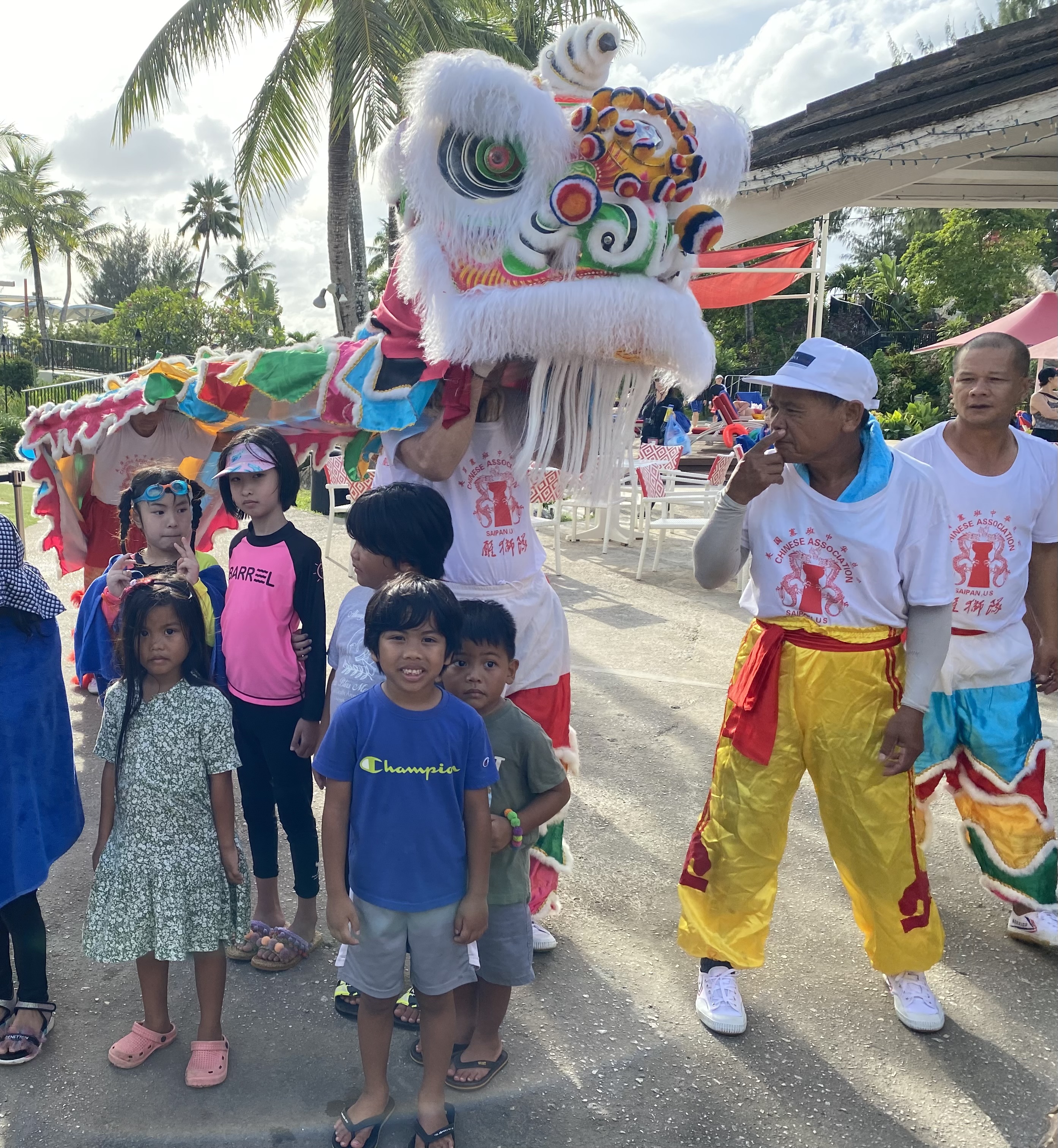 Children pose for a photo with the dragon dancers at a past Lunar New Year event. 