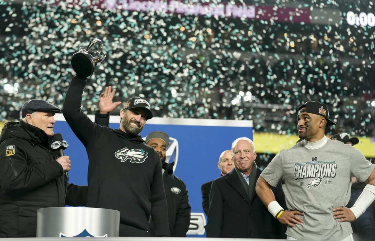 Philadelphia Eagles head coach Nick Sirianni celebrates with the trophy after their win against the Washington Commanders in the NFC championship game, Sunday, Jan. 26, 2025 in Philadelphia.