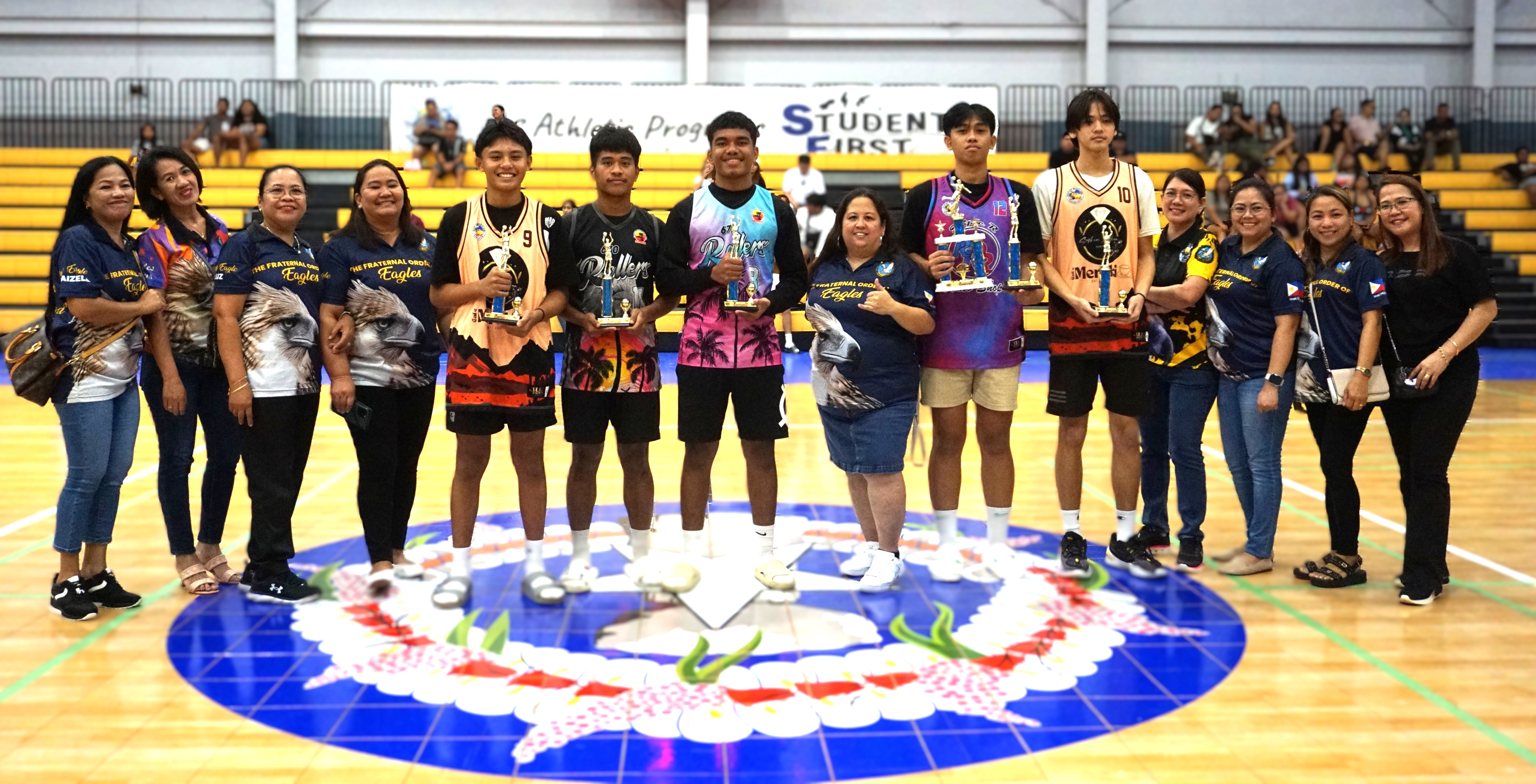 The Mythical Five in the U17 division of the 2nd SMEC-SMLEG Basketball Tournament pose for a group photo with SMLEG officials during the awards ceremony at the Ada gym on Sunday.