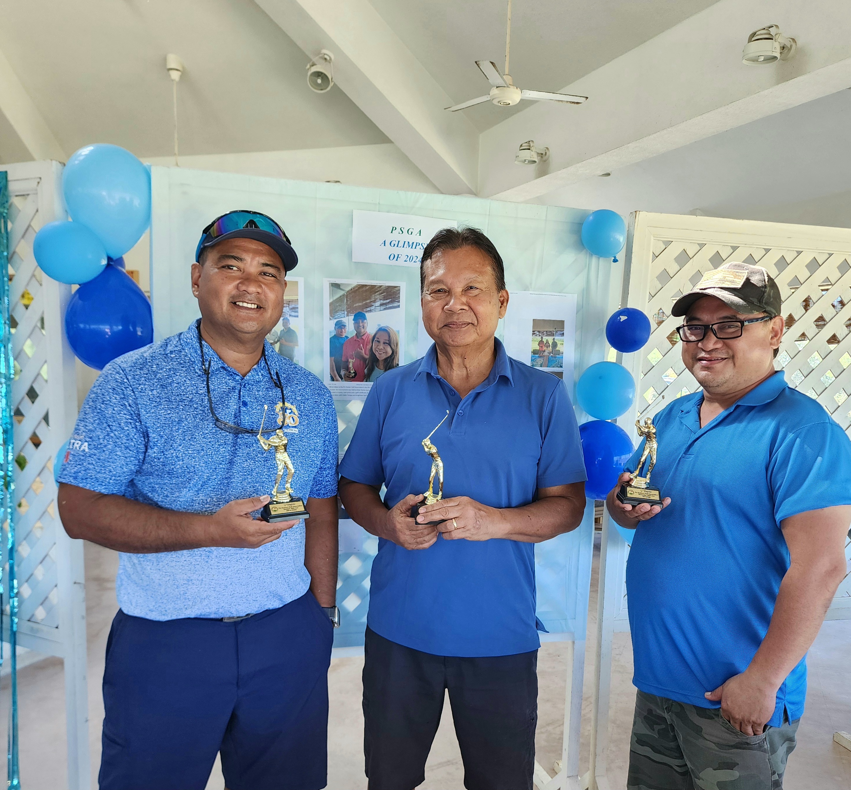 Alfred Aldan and Eddie Terlaje, PSGA October & November Aces, pose with their trophies with the January Ace, Joe Bermudes, center.