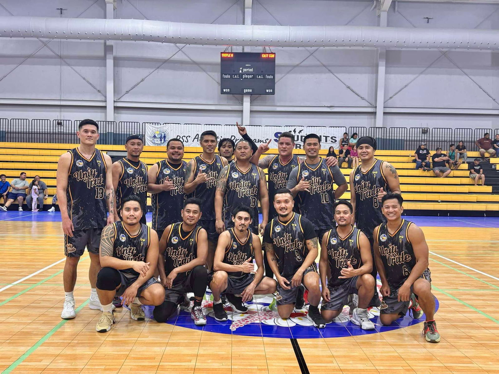 Unity Trade players pose for a photo after trouncing East Side Cuts/Saipan Fresh Market, 83-63, to advance to the open division finals of the 2nd Saipan Magalahi Eagles Club-Saipan MagaHaga Lady Eagles Group Basketball Tournament at the Ada gym on Saturday.
