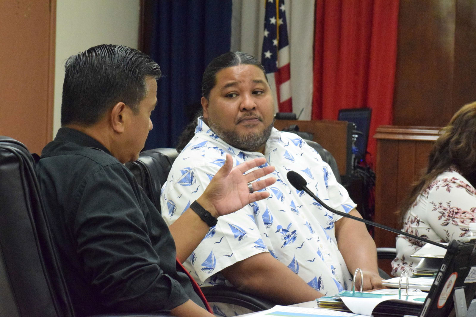 Sen. Karl King-Nabors, right, listens to Sen. Jude U. Hofschneider during a break from the 23rd Senate’s sine die session on Friday.