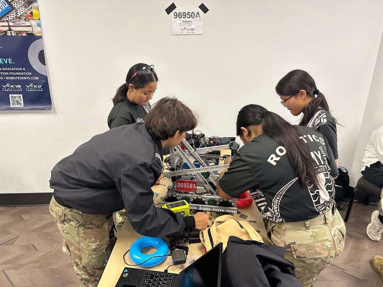 The Marianas High School Dolphins work on their robot during the 8th Brigade Robotics Competition in San Diego, California on Feb. 1, 2025.