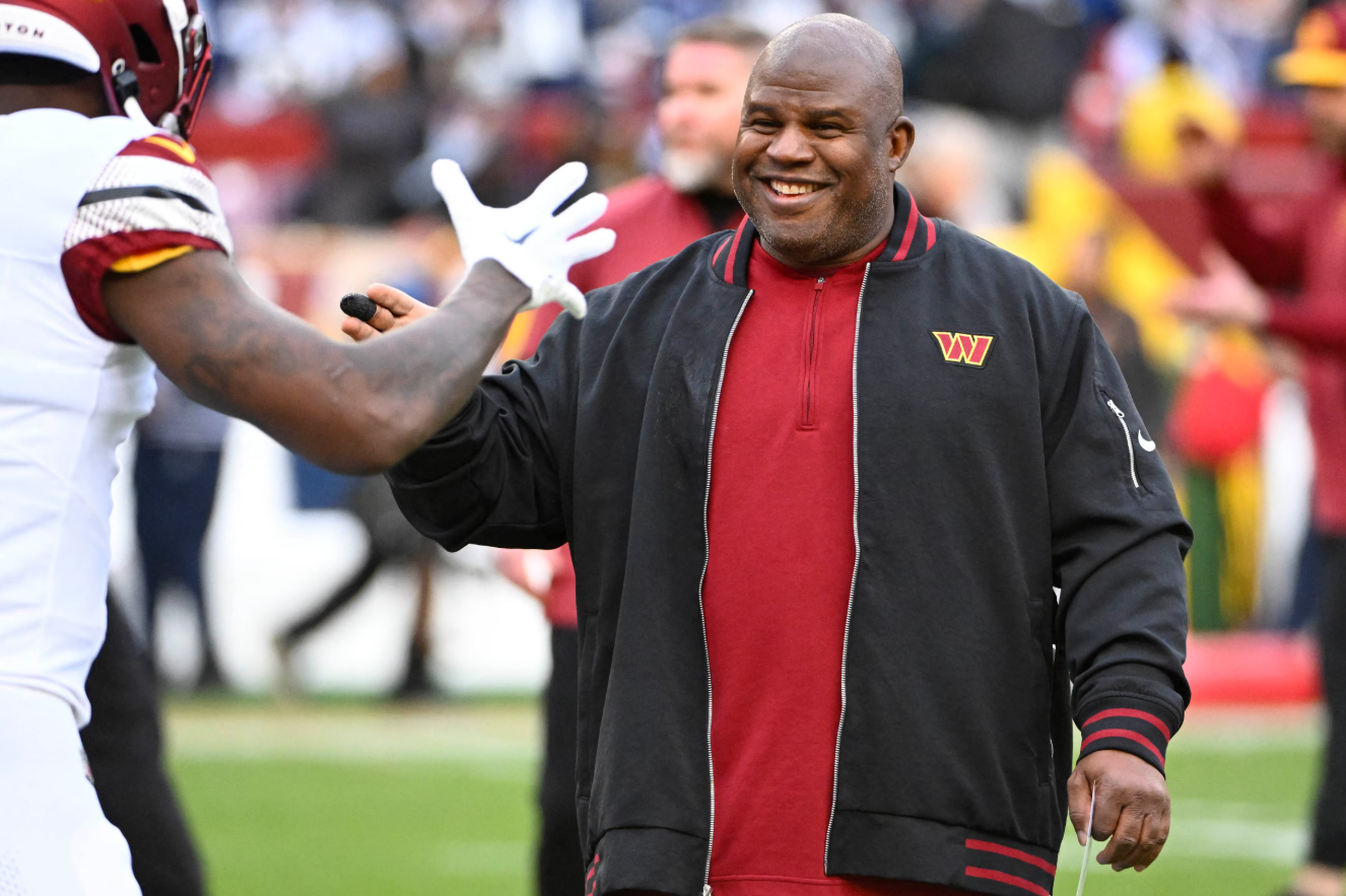 Washington Commanders offensive coordinator Eric Bieniemy on the field before the game against the Dallas Cowboys at FedExField in Landover, Maryland, Jan. 7, 2024.