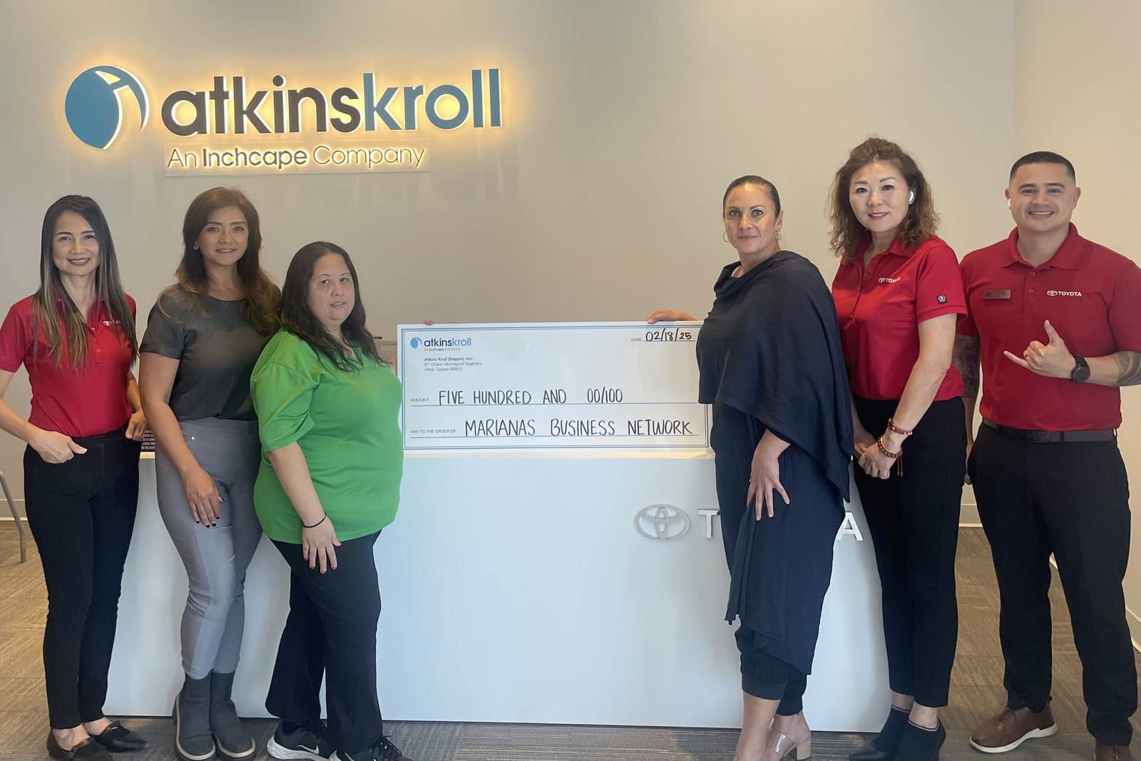 Atkins Kroll General Manager Tracy Guerrero joins AK Toyota staff and Marianas Business Network’s Sonya Dancoe, 2nd left, and Aileen Arnold, 3rd left, for a group photo to mark AK’s sponsorship of the Marianas Business Showcase.