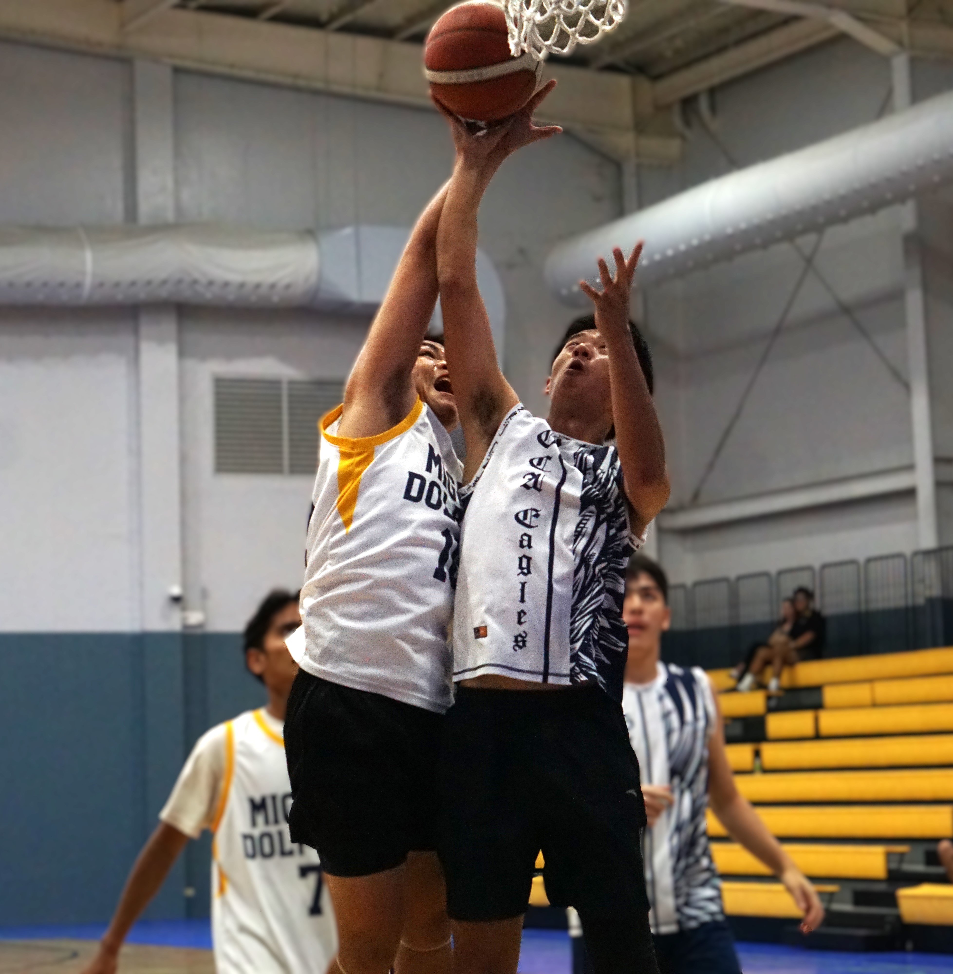MHS V's Nolan Cultura blocks GCA’s JiaHao Yang during a boys high school division game of the PSS-NMIBF Interscholastic Basketball League SY24-25 at the Ada gym on Wednesday.