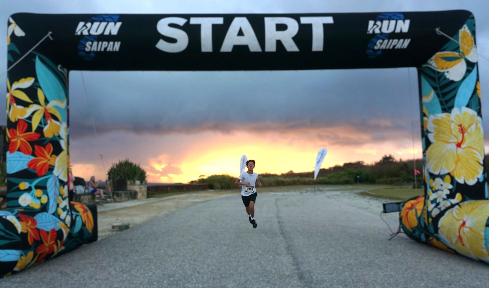 Victory Nash Santos crosses the finish line of Run Saipan’s Trinity 2025’s Marpi Trail Run at Banzai Cliff on Monday morning.
