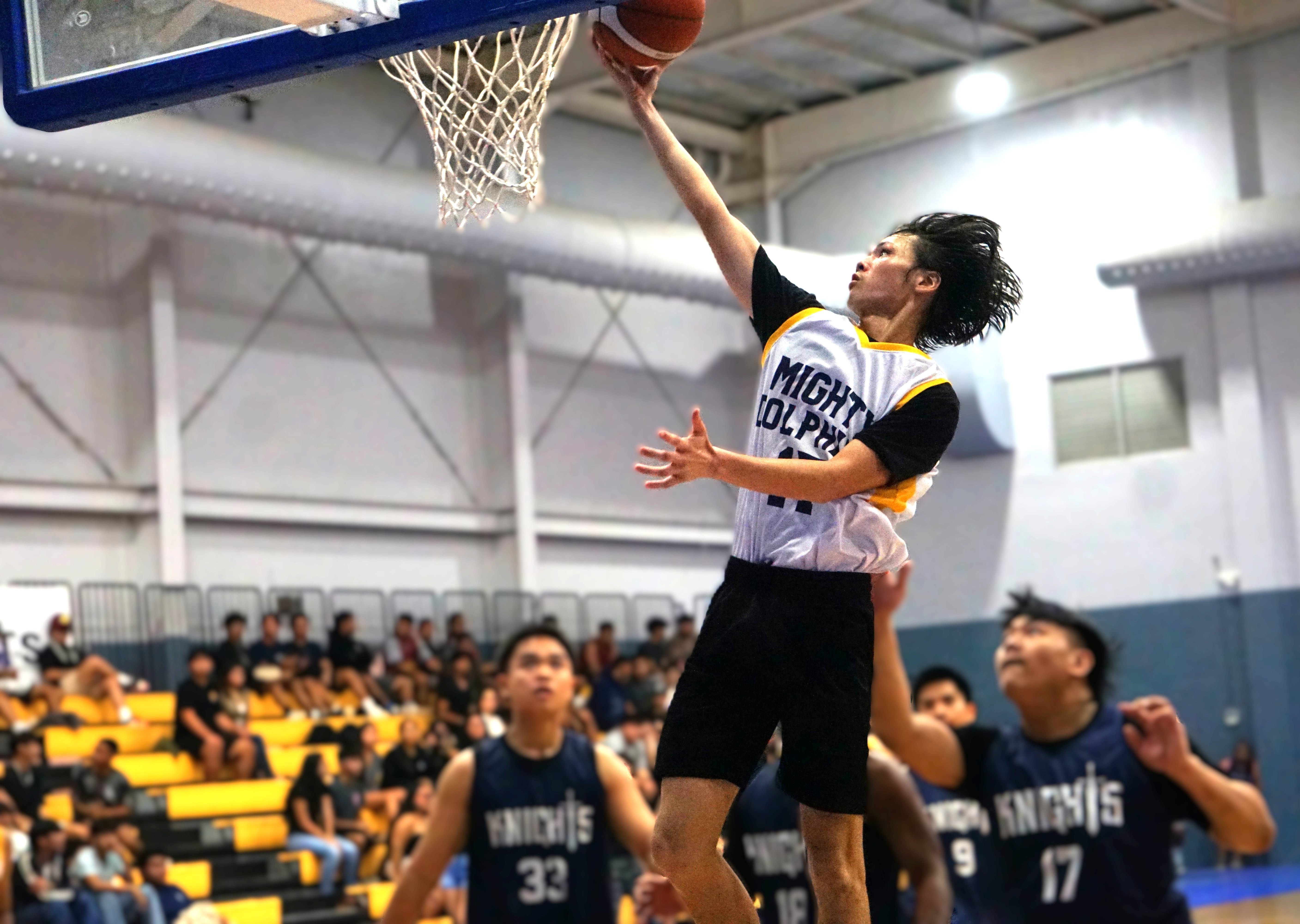 MHS’ Carl Sanchez extends for the finish during an opening game against MCS in the boys high school division of the PSS-NMIBF Interscholastic Basketball League SY24-25 at the Gilbert C. Ada Gymnasium on Friday.