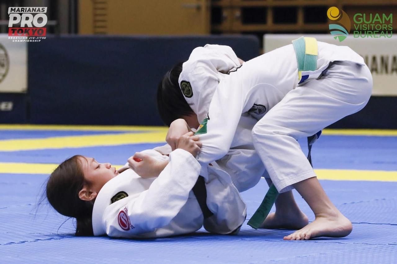 Reiden Travilla attempts a transition to a triangle lock against his opponent during a match in the Kid 5 Grey Belt Rooster division of the Marianas Pro Tokyo 2025 in Japan on Feb 8.
