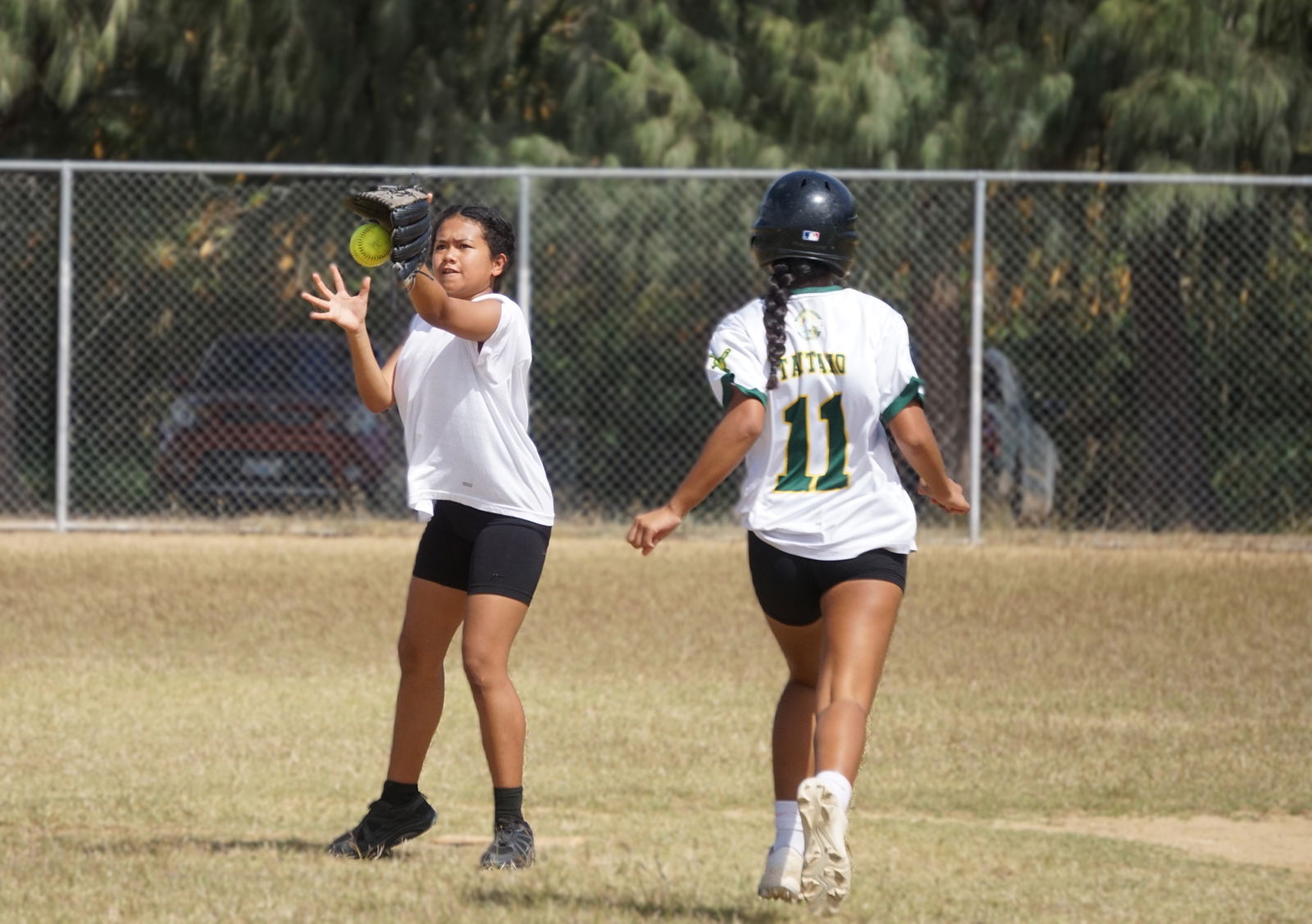Tanapag Middle School second baseman Ivalyn secures the ball to pick off a runner during a game against Dandan Middle School in the girls middle school division of the PSS-NMISA Interscholastic Fastpitch Softball League SY24-25 at the Dandan softball field on Saturday.