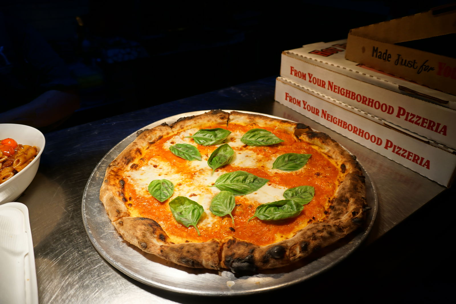 A fresh Margherita pizza is ready for its customer at The Angry Penne.