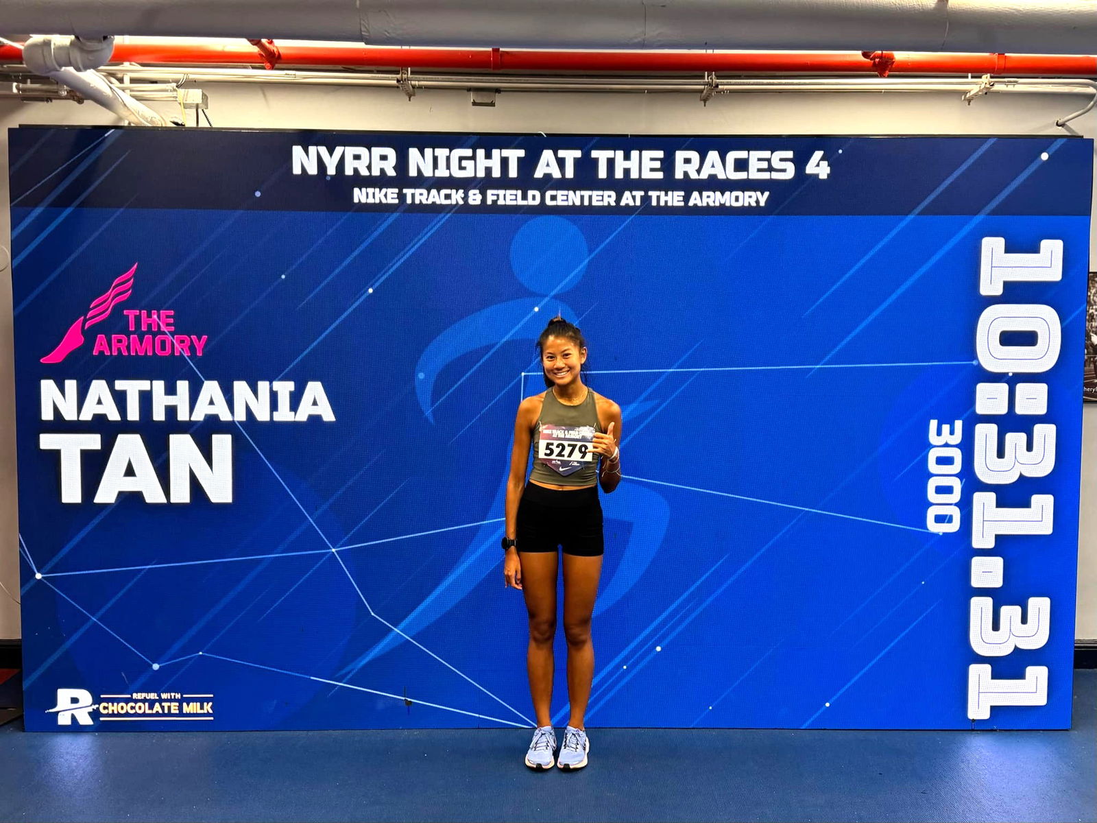 Tania Tan poses for a photo after clocking 10:31.31 in the Women’s 3000m event of the NYRR Night at the Races at the Armory Track in New York.
