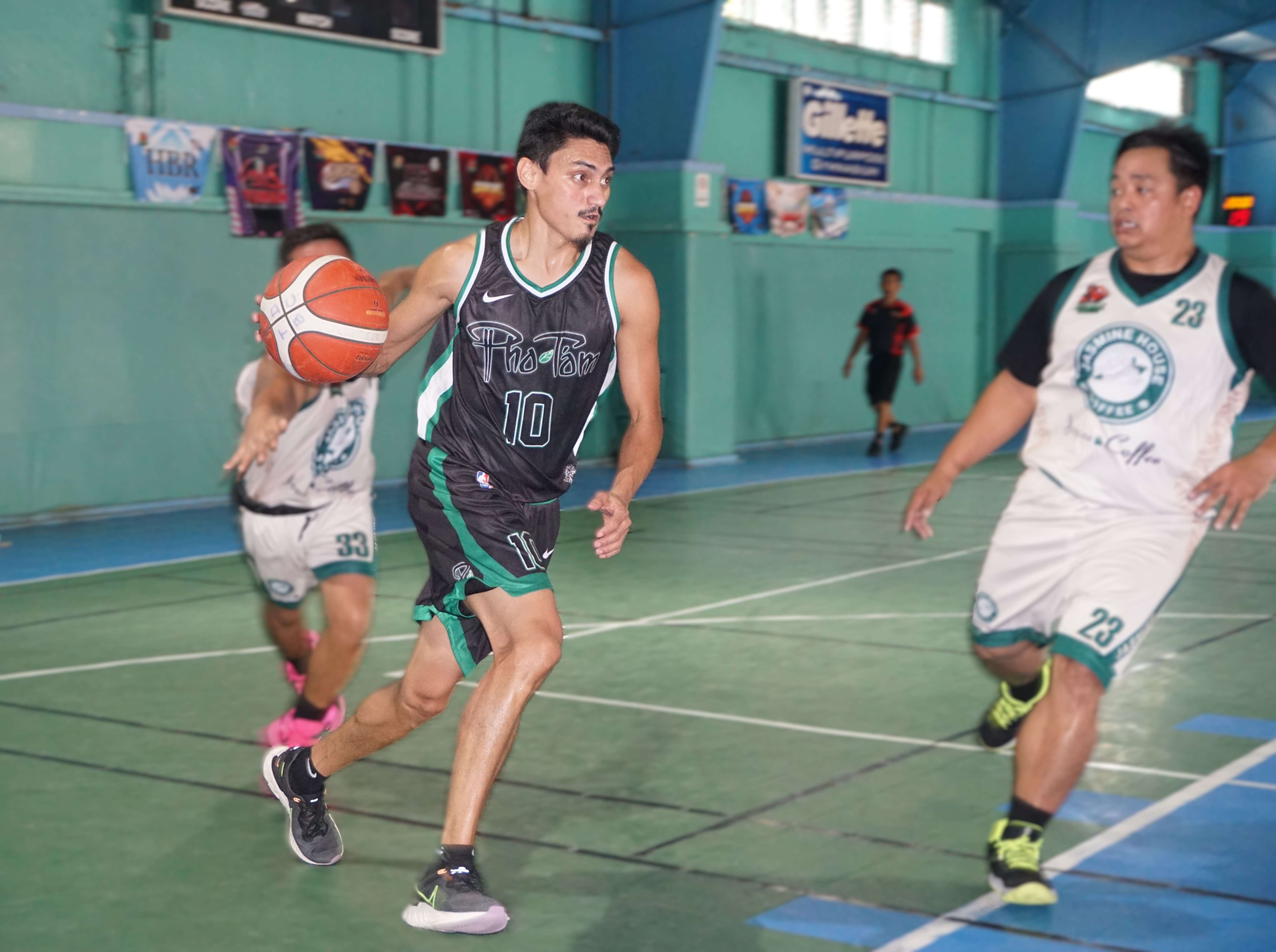Pho Tam Restaurant's Douglas Schmidt dribbles toward the paint during a game against Jasmine House in the Alpha Kappa Rho 1st Semi-Open Invitational Basketball League 2025 at the TSL Sports Complex.