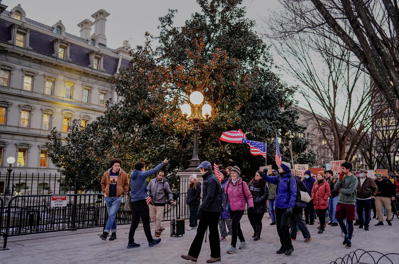 People gather during a rally in support of federal funding and in opposition to President Donald Trump's order to pause all federal grants and loans, near the White House in Washington, D.C., Jan. 28, 2025.