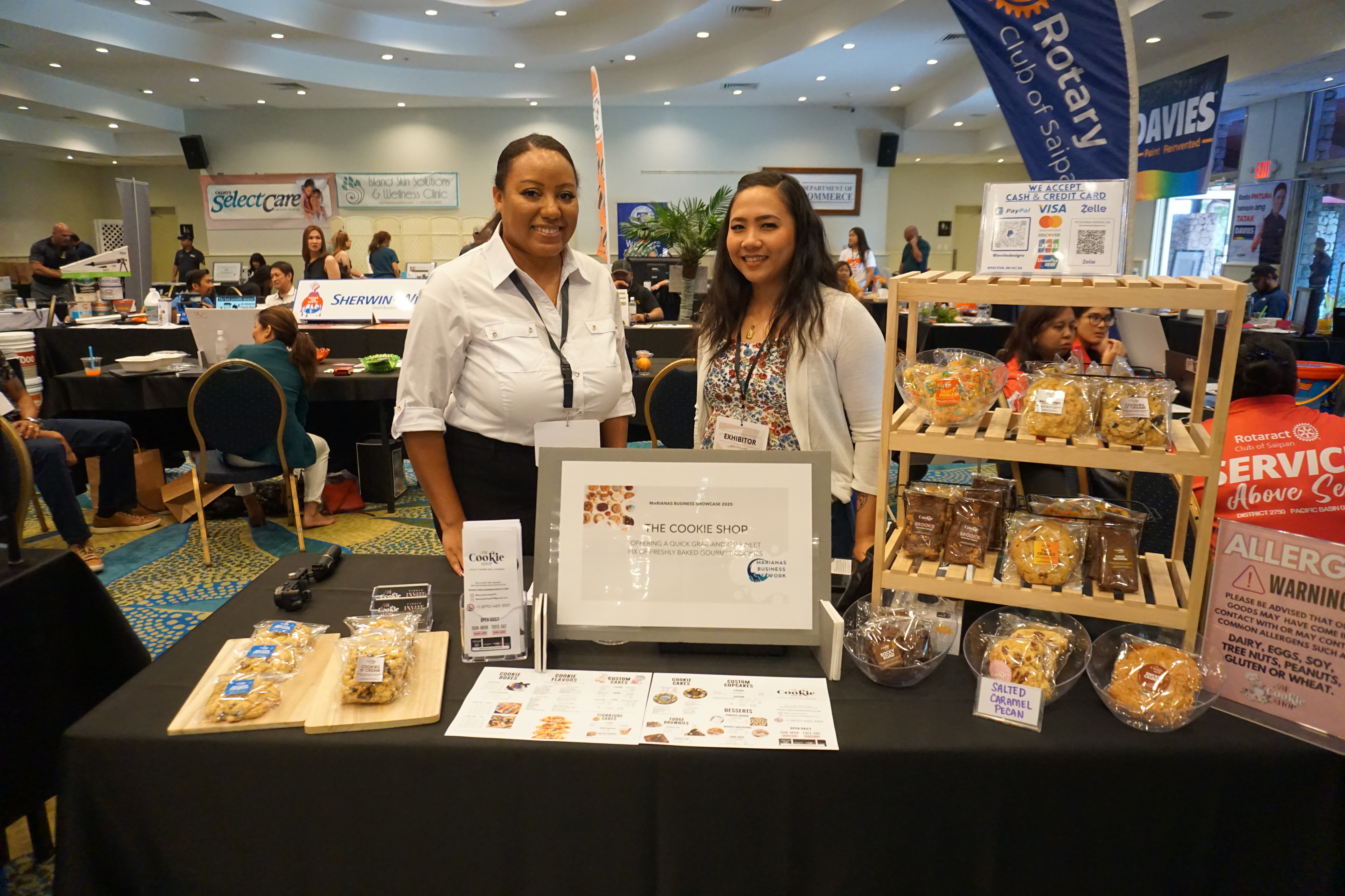 Dee Lizama Parker, left, was at the showcase for her small business, The Cookie Shop.