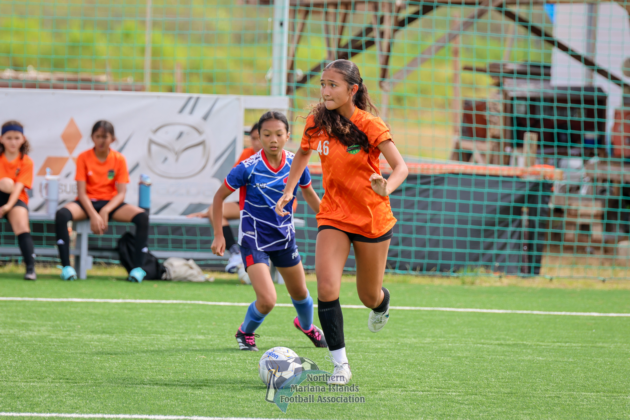 Kanoa FC's Beatrice Gross looks around for an open teammate during a match against Shirley's FC in the U17 girls division of the TakeCare Youth Soccer League Spring 2025 at the NMI Soccer Training Center in Koblerville.