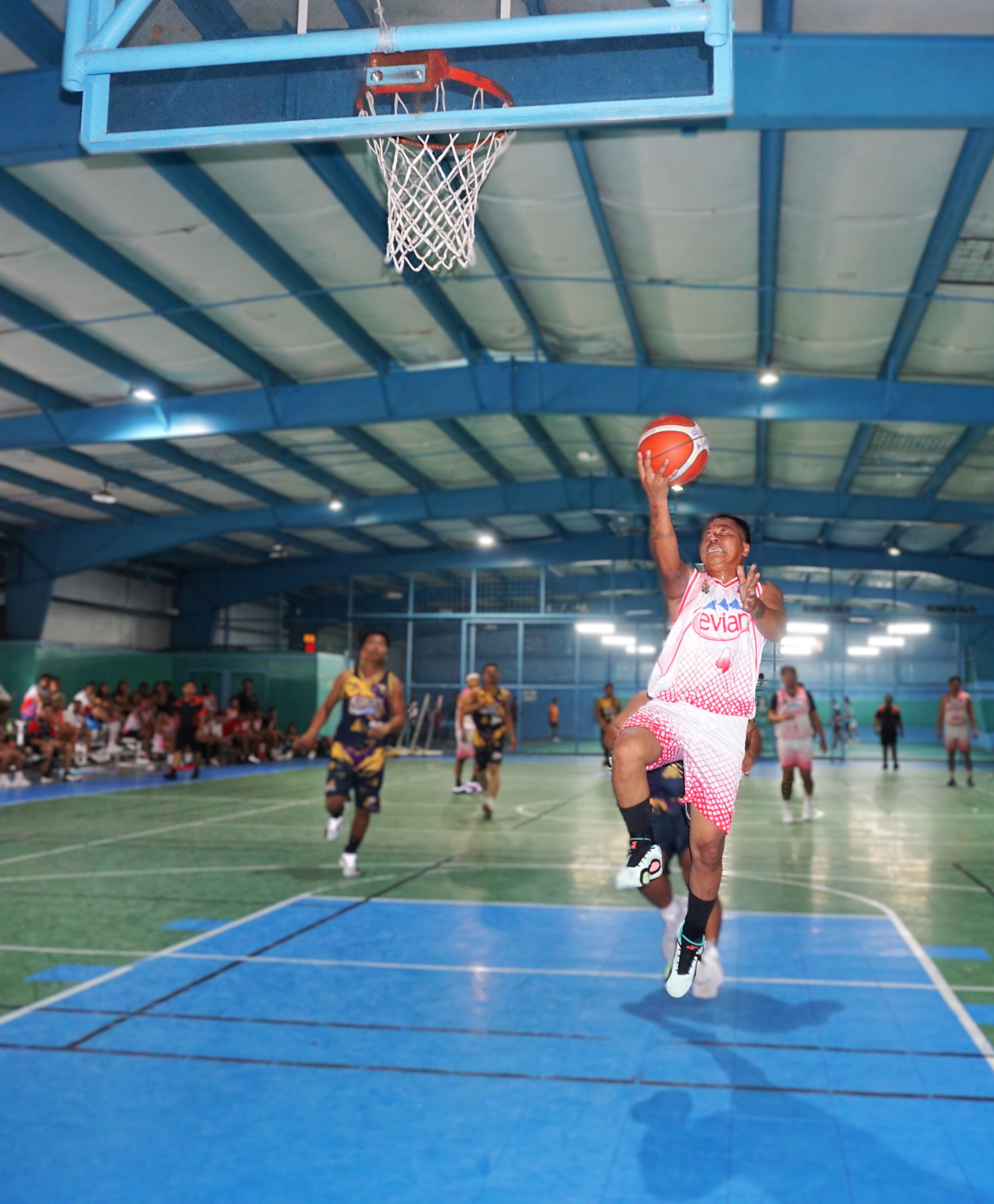 JCME/Evian Team's Brendon Talania extends for the fastbreak finish during a game in the Alpha Kappa Rho 1st Semi-Open Invitational Basketball League 2025 at the TSL Sports Complex on Sunday.
